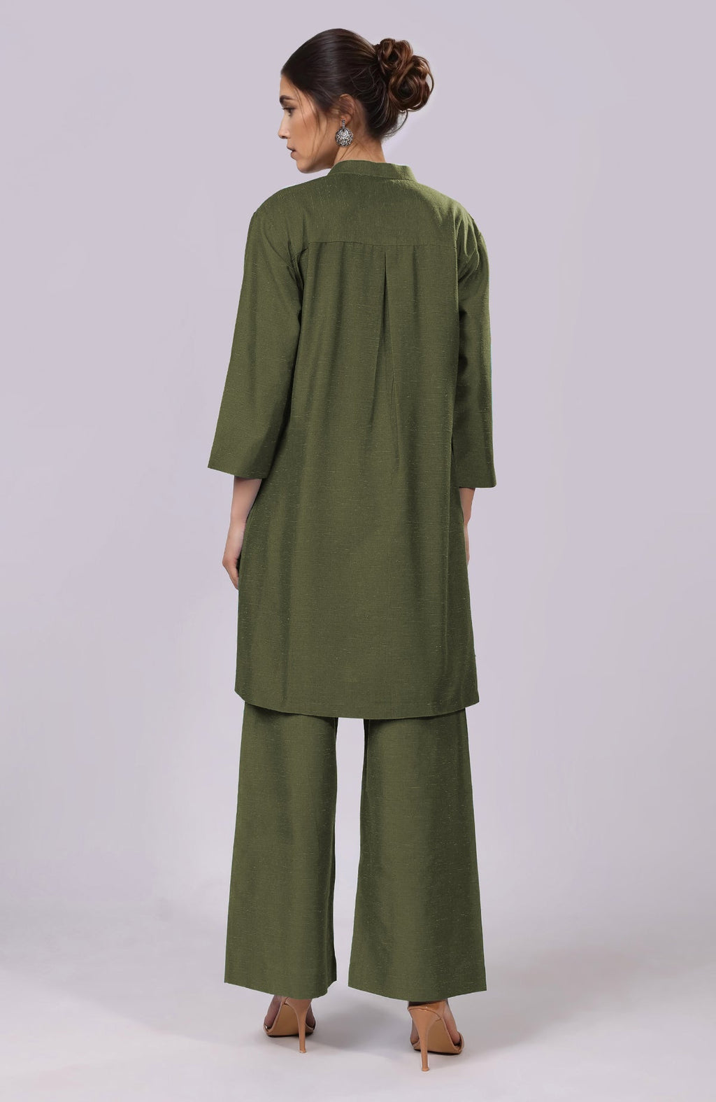 A woman from behind wears a martini olive co-ord set with wide-leg pants.
