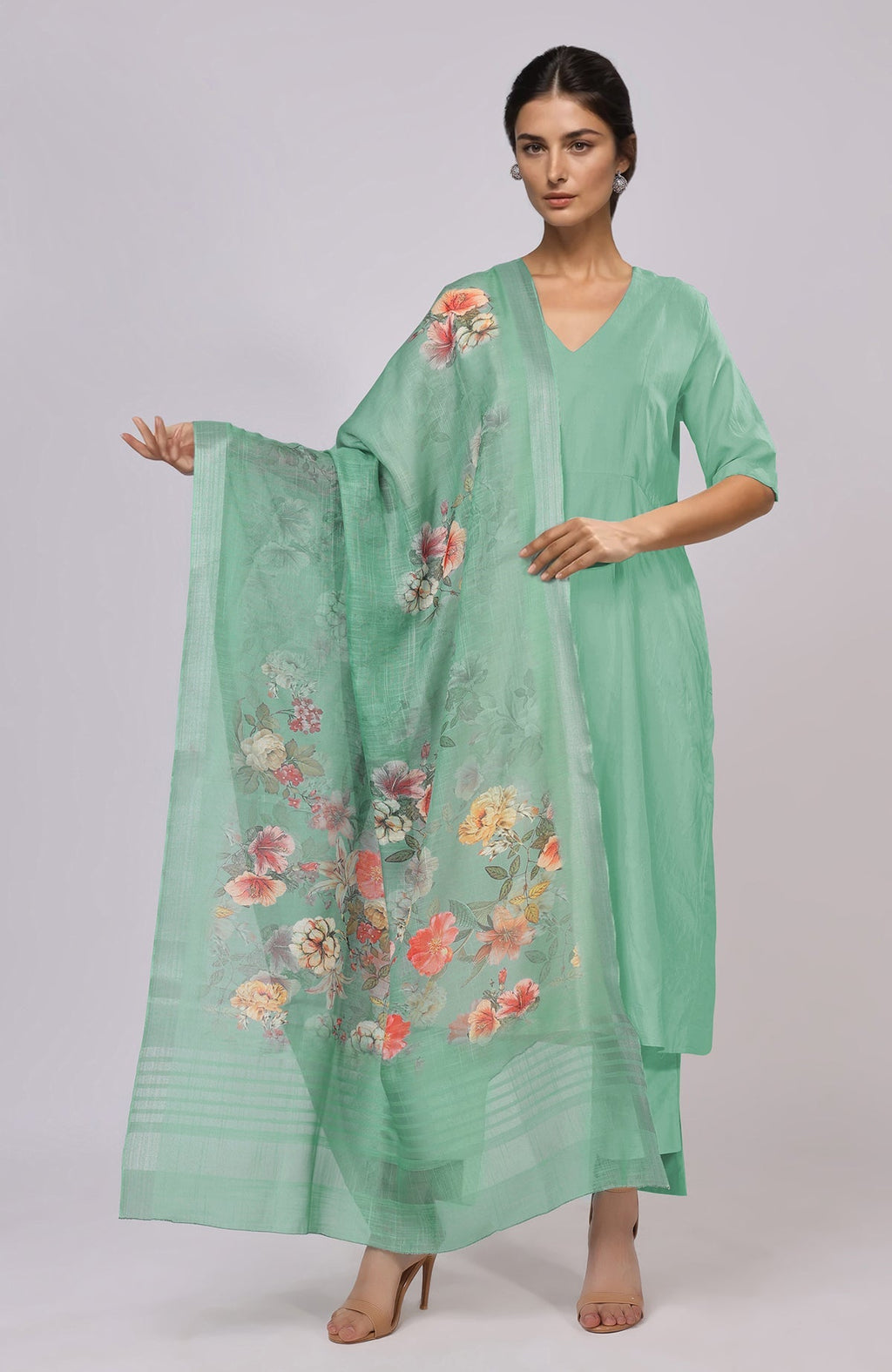 Dusty jade green floral linen dupatta with a matching suit and nude heels.