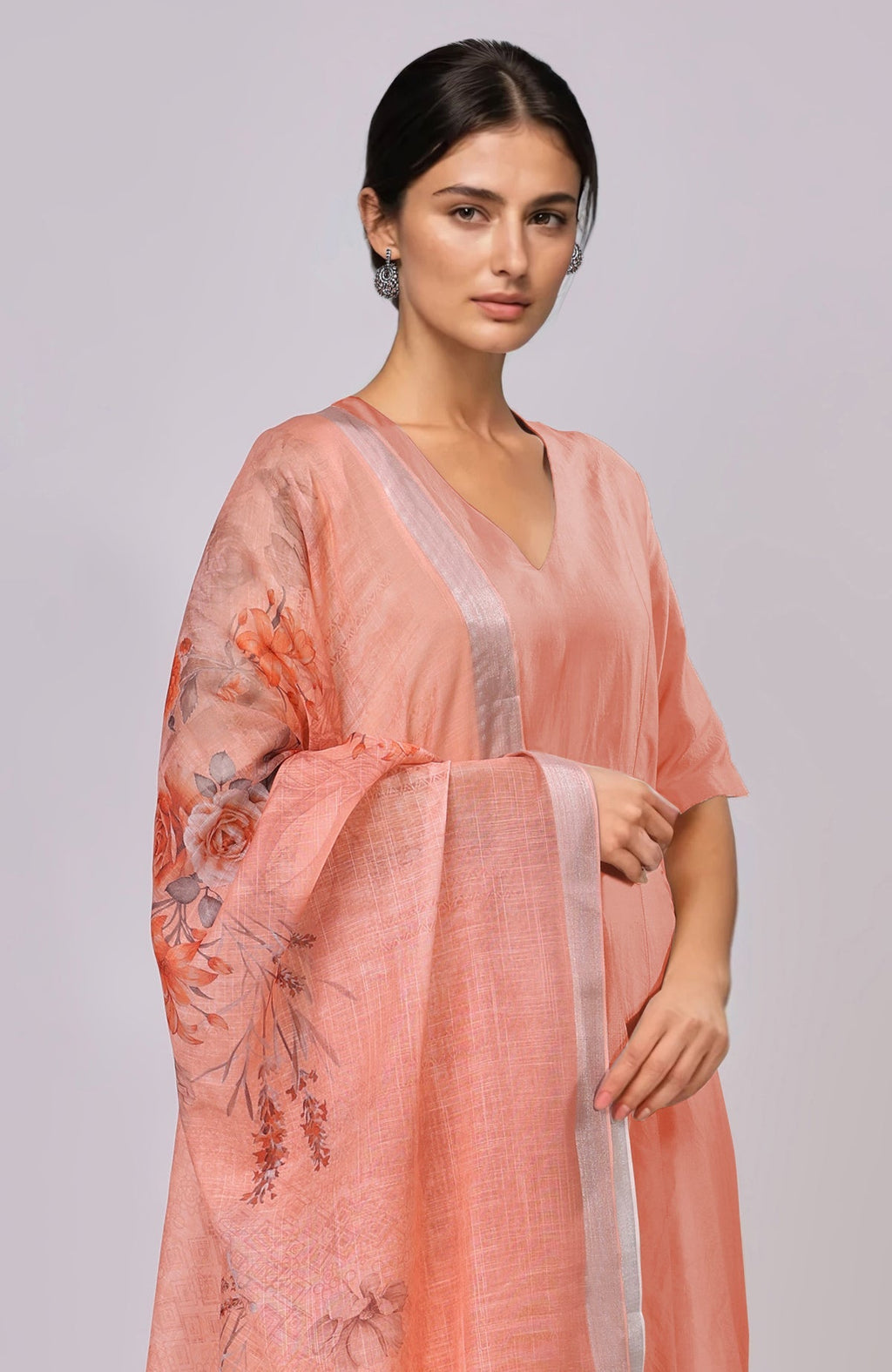 Peach floral linen dupatta with suit.