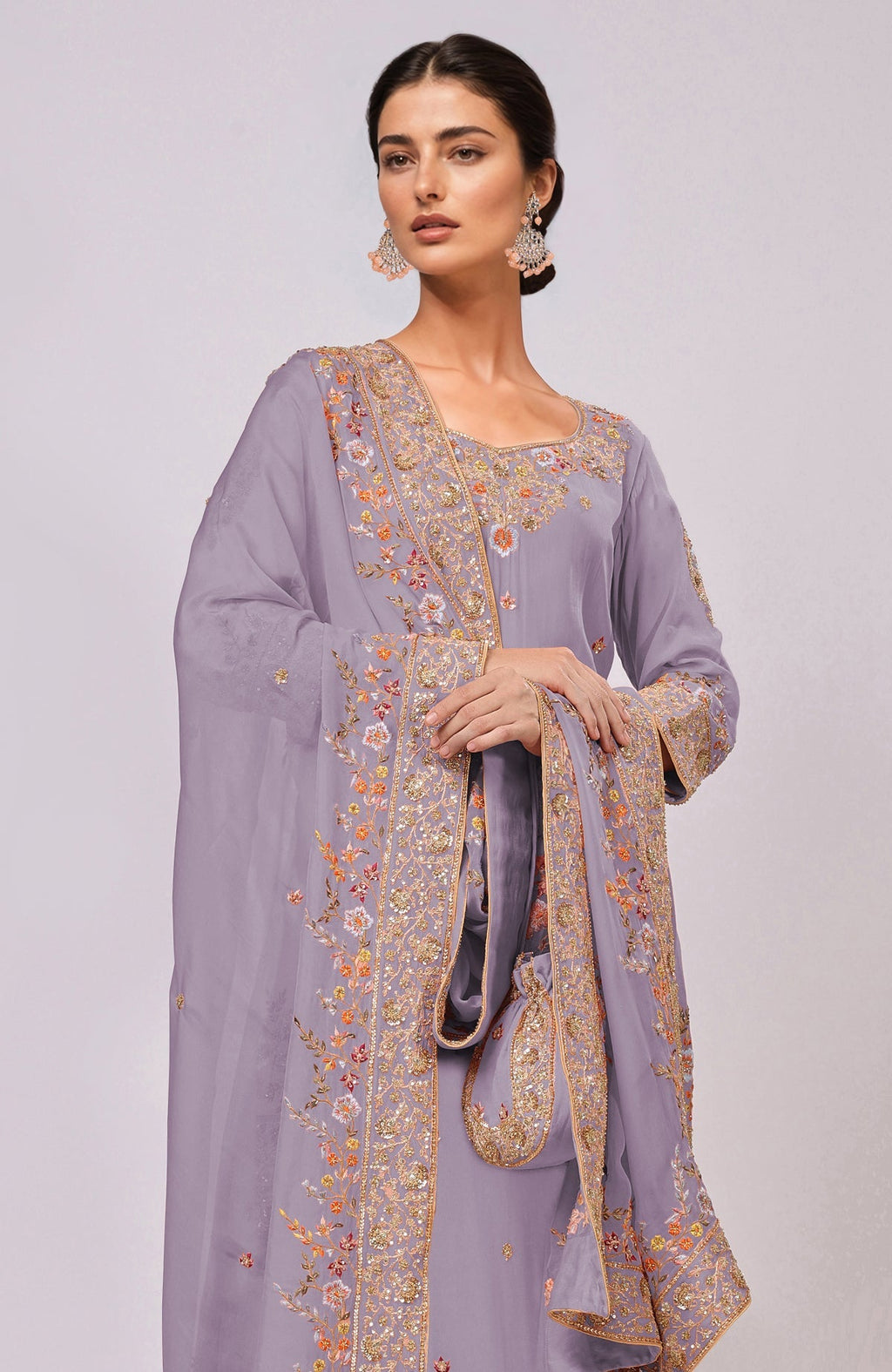 A woman models an Elder Berry Marori and Resham Hand Embroidered Kurta Set.