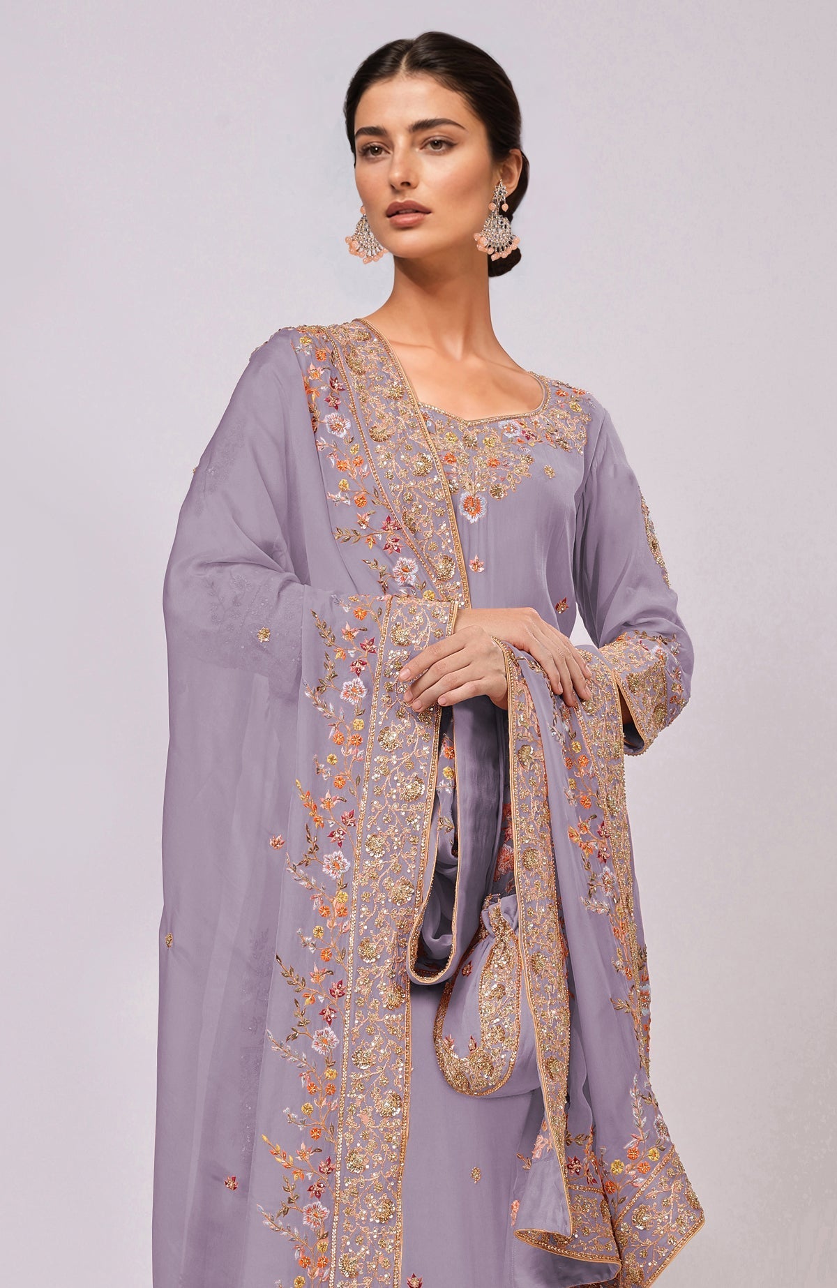 A woman models an Elder Berry Marori and Resham Hand Embroidered Kurta Set.