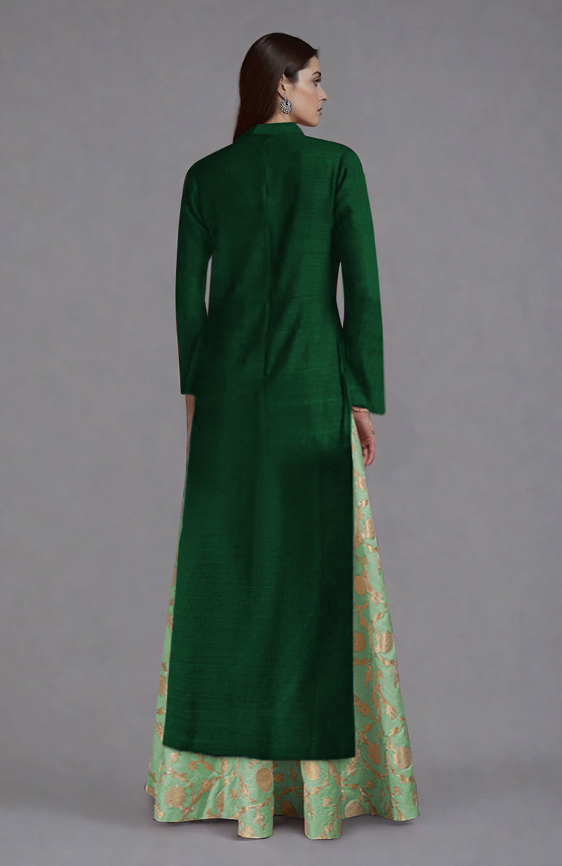 Emerald green raw silk jacket with a mint green and gold brocade skirt.