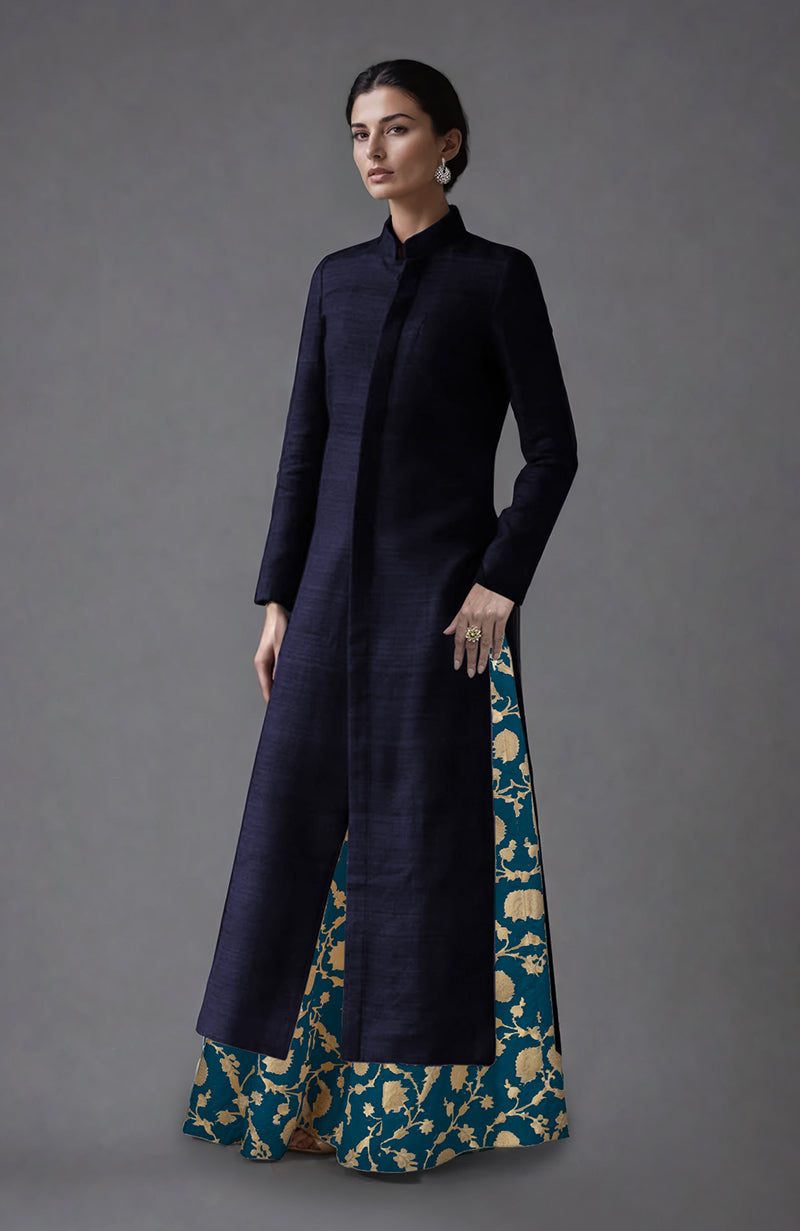 Eclipse blue raw silk jacket with a teal and gold brocade skirt.