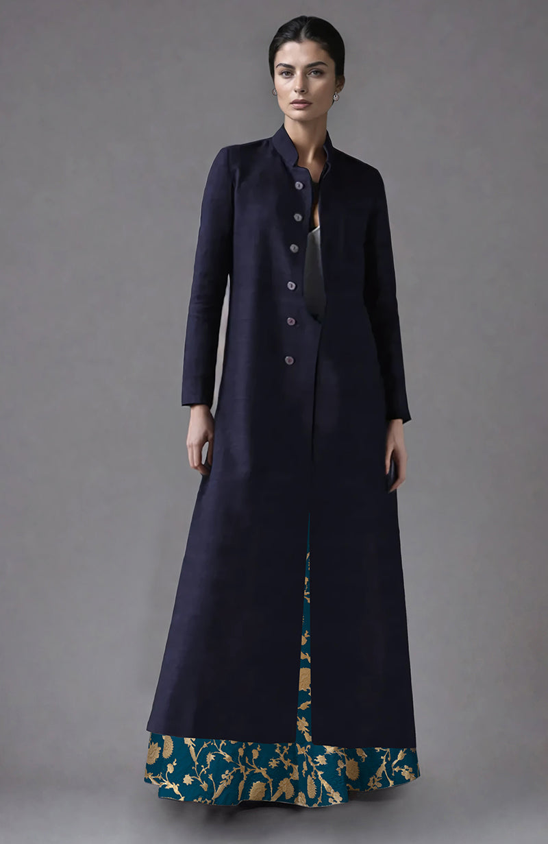 An Eclipse Blue raw silk jacket with a banarasi brocade skirt.