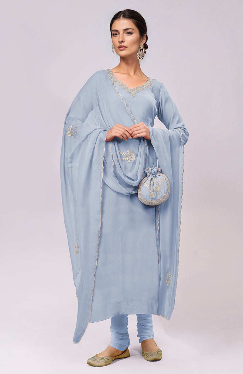 Dusty blue Kashmiri Tilla Aari embroidered kurta set with matching potli bag.