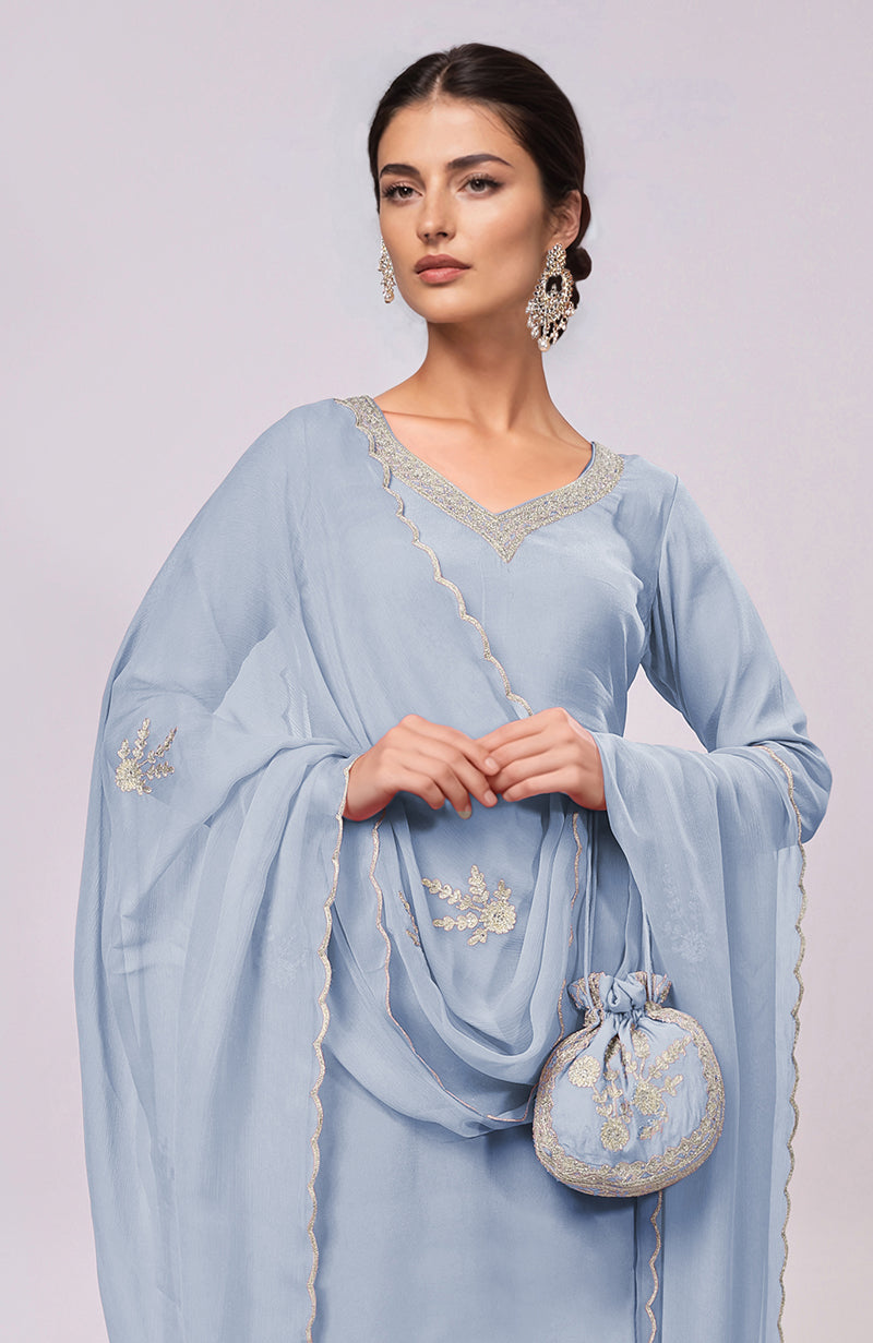 Dusty blue Kashmiri Tilla Aari embroidered kurta set with matching potli bag.