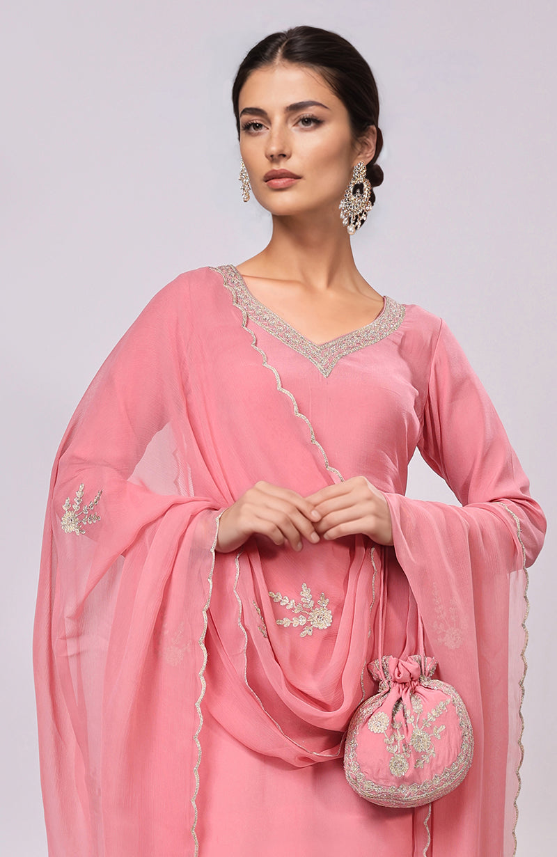 Pink Kashmiri Tilla Aari embroidered kurta set with matching potli bag.