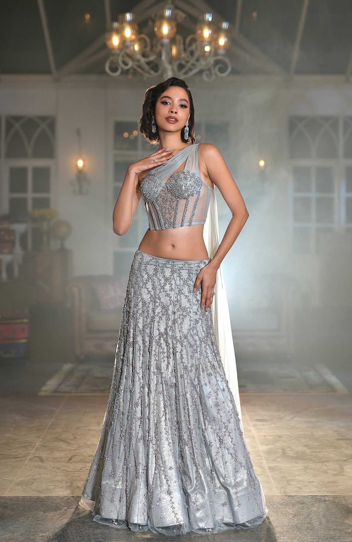 Silver grey hand-embroidered corset lehenga set with silver crystal floral details and one-shoulder cape