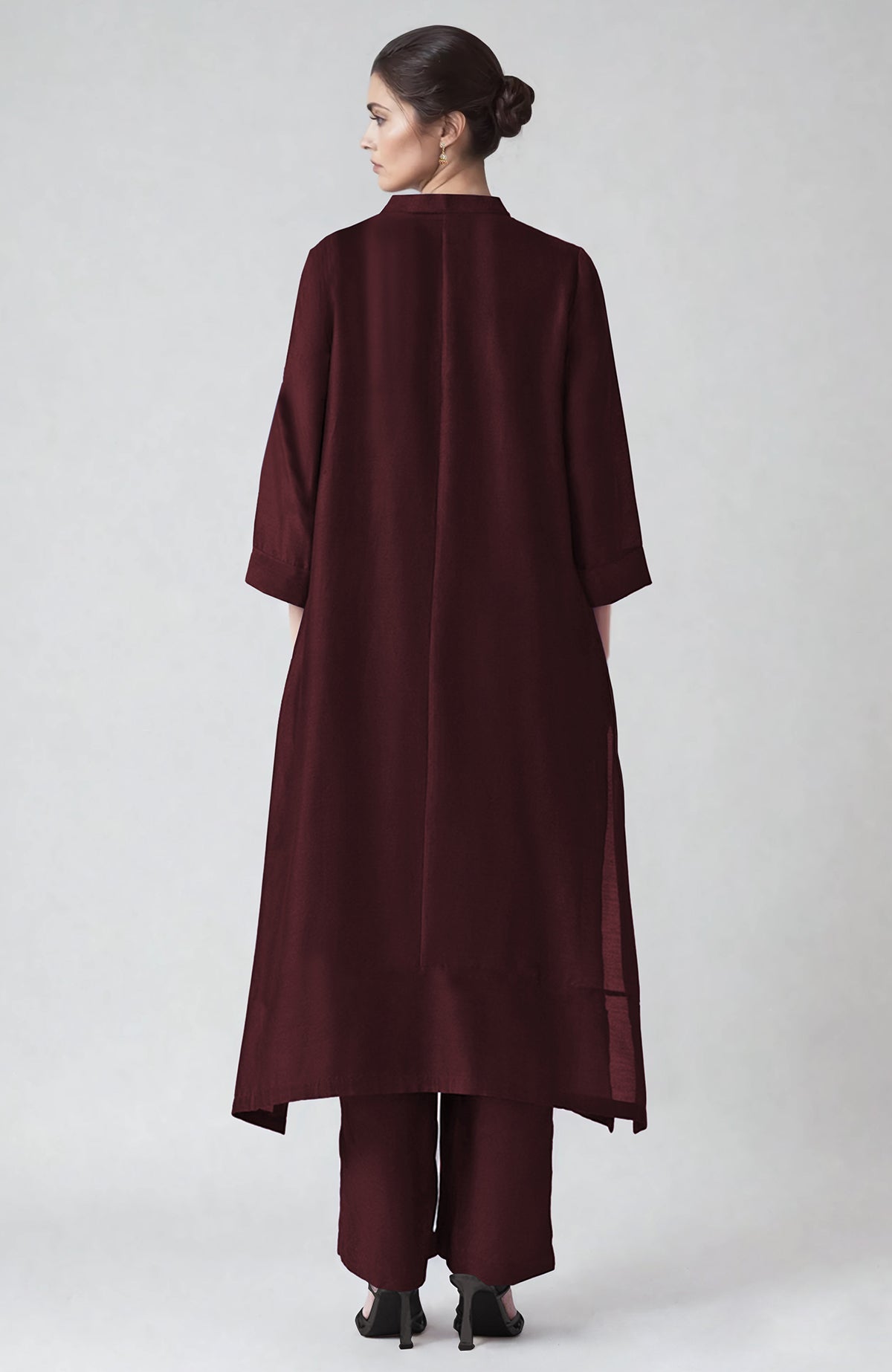 Wine-colored kaftan set with ivory Parsi Gara embroidery and matching straight pants.
