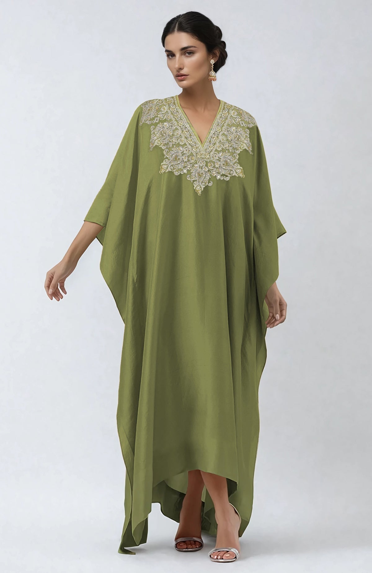 Bog green kaftan with intricate Kashmiri tilla and zardozi embroidery on the placket.
