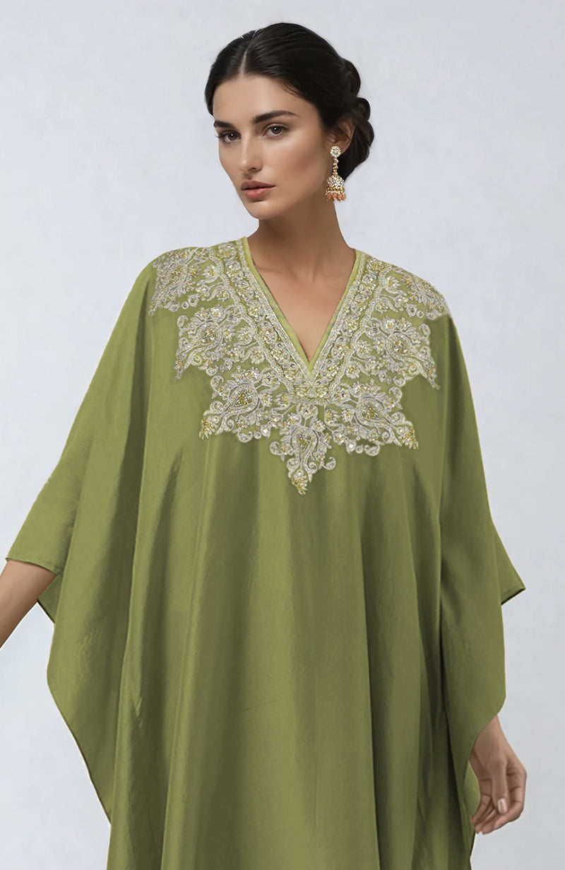 Bog green kaftan with intricate Kashmiri tilla and zardozi embroidery on the placket.