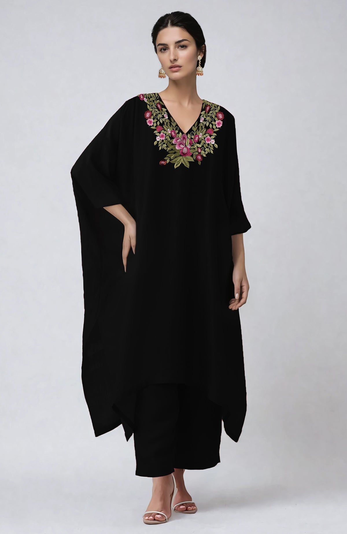 Black kaftan set with vibrant floral embroidery along the V neckline and flowing sleeves