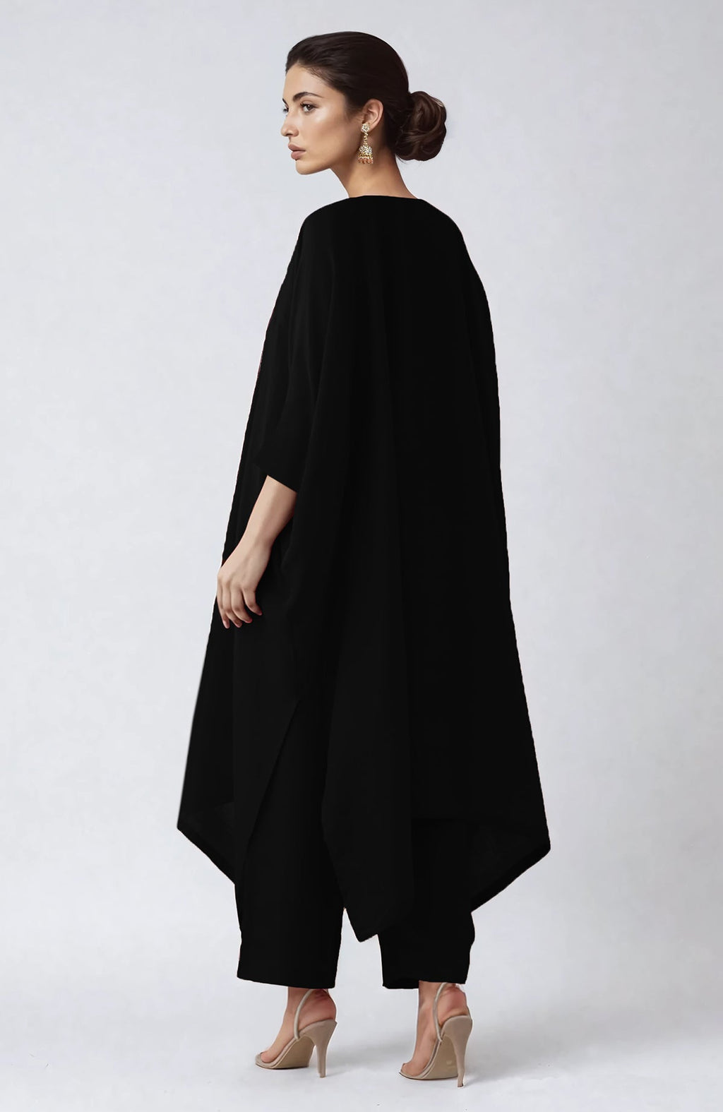 Black kaftan set with vibrant floral embroidery along the V neckline and flowing sleeves