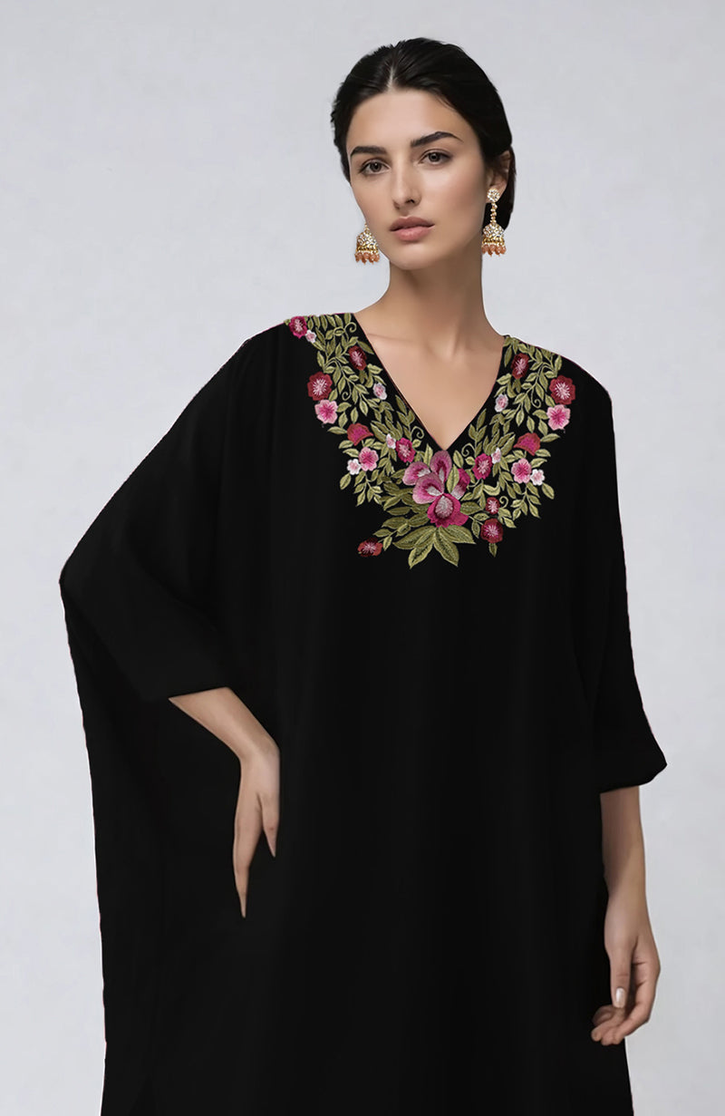 Black kaftan set with vibrant floral embroidery along the V neckline and flowing sleeves