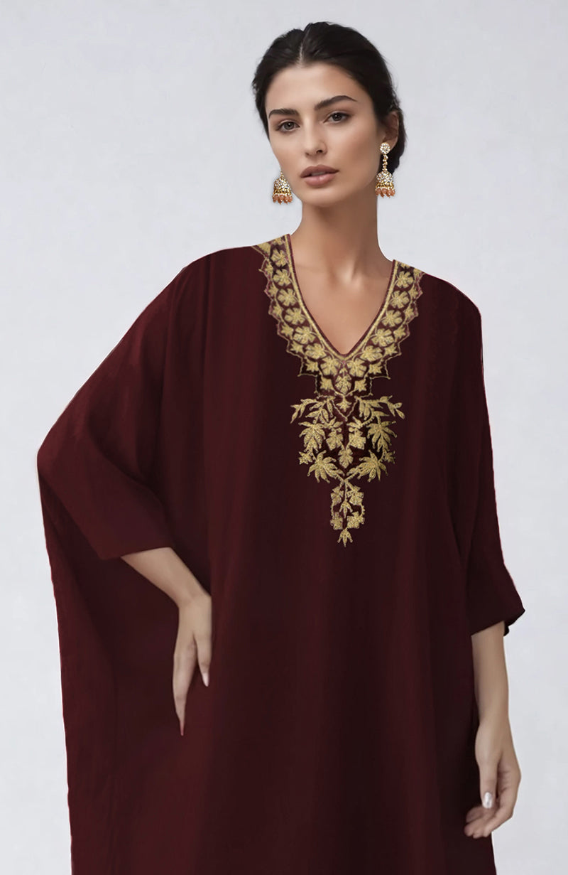 Wine-colored kaftan with intricate Kashmiri Tilla Aari embroidery along the placket.