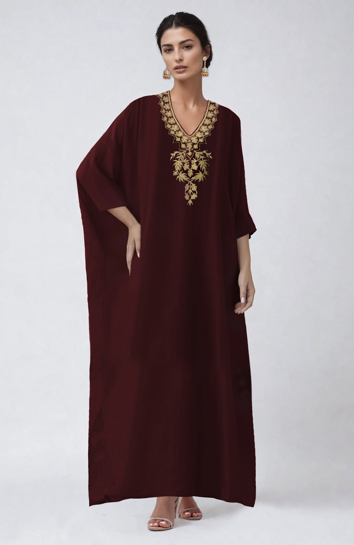 Wine-colored kaftan with intricate Kashmiri Tilla Aari embroidery along the placket