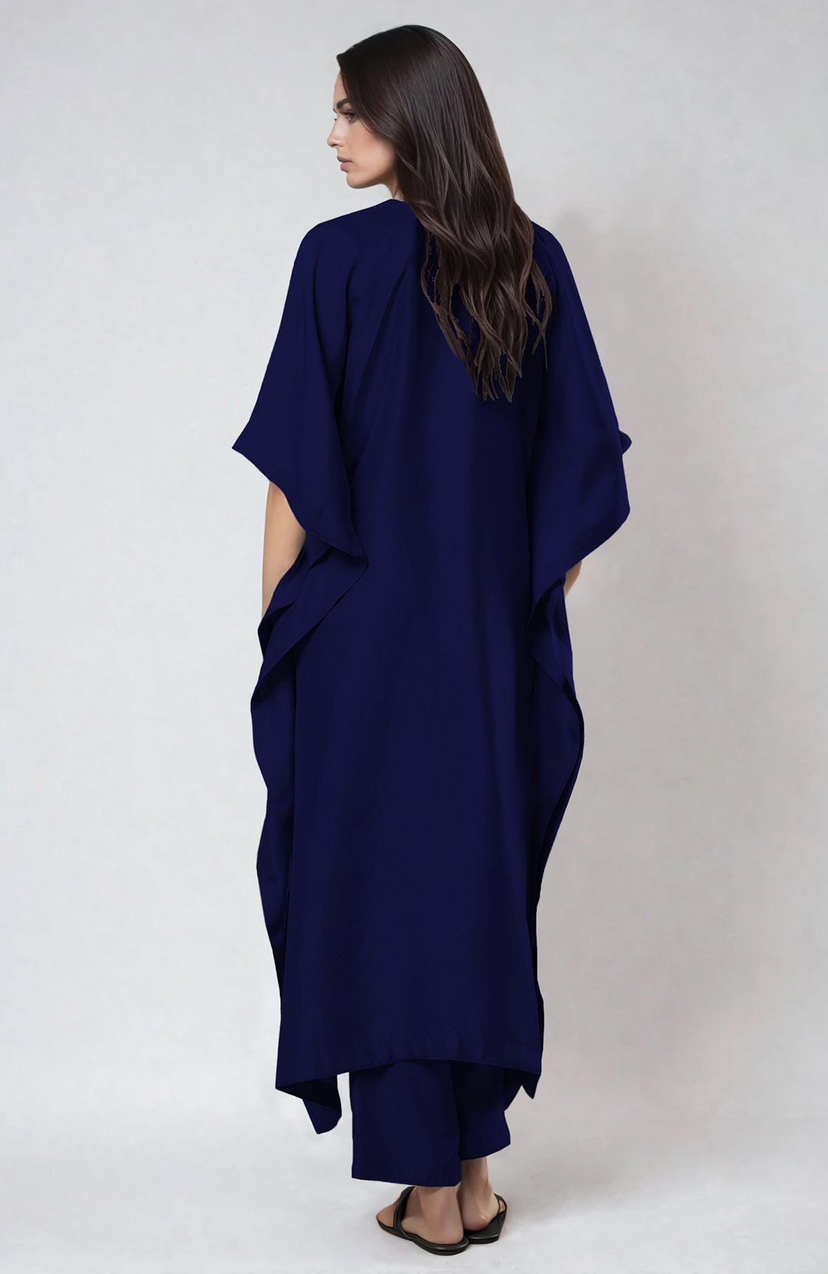 Midnight blue kaftan set with intricate floral Resham, Papier Mache, and Tilla embroidery on neckline.