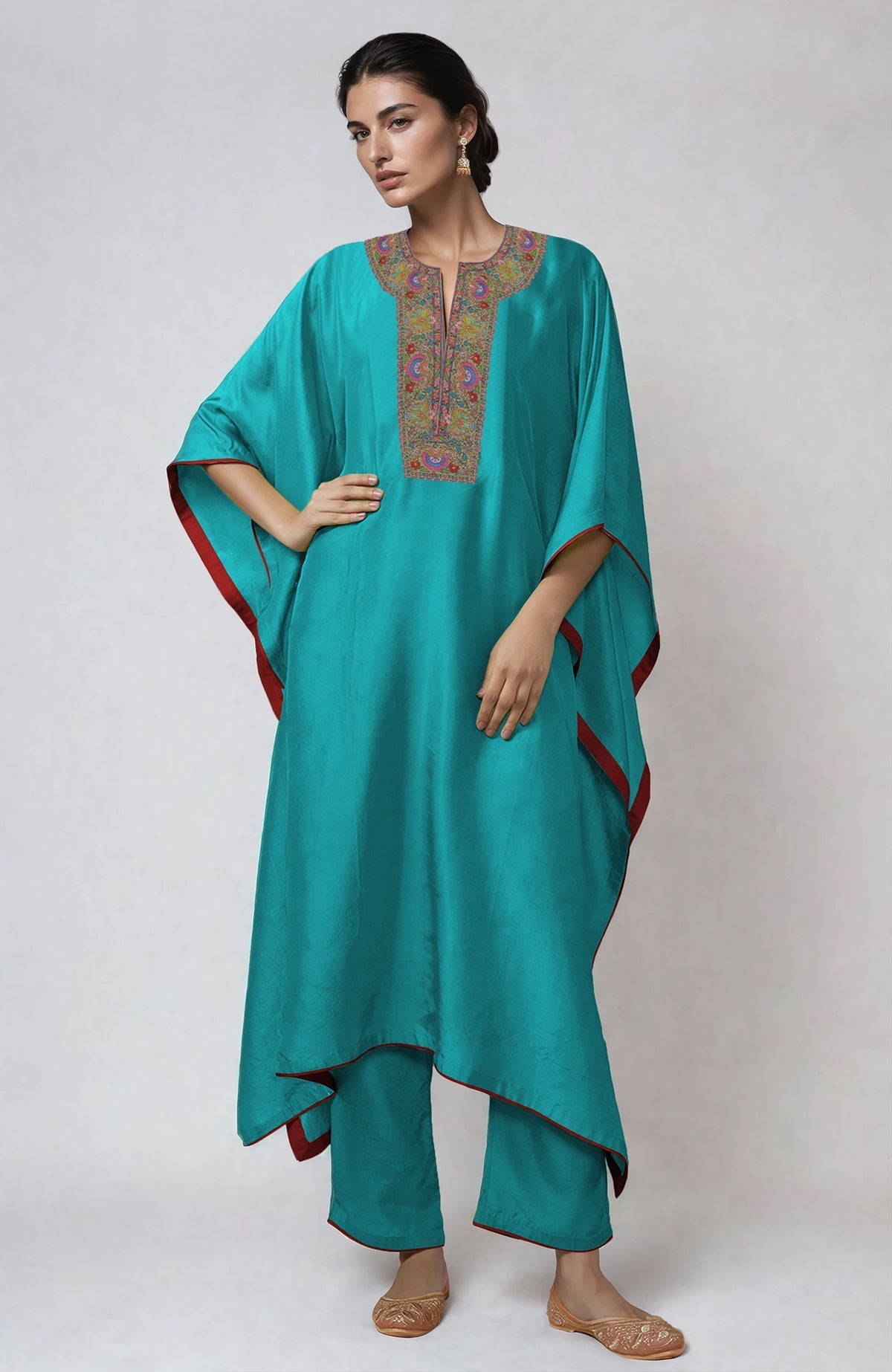 Viridian green kaftan set with intricate Kashmiri kashidakari embroidery on placket and cuffs.