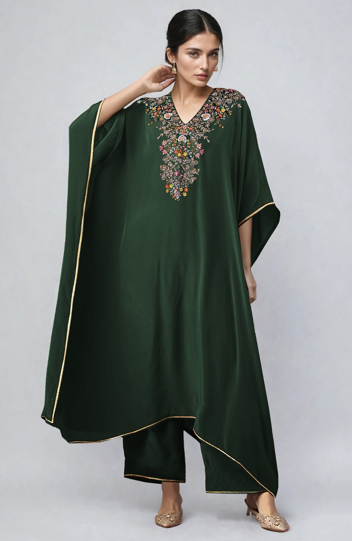 Bottle green kaftan with gold marori and resham embroidery paired with straight pants.