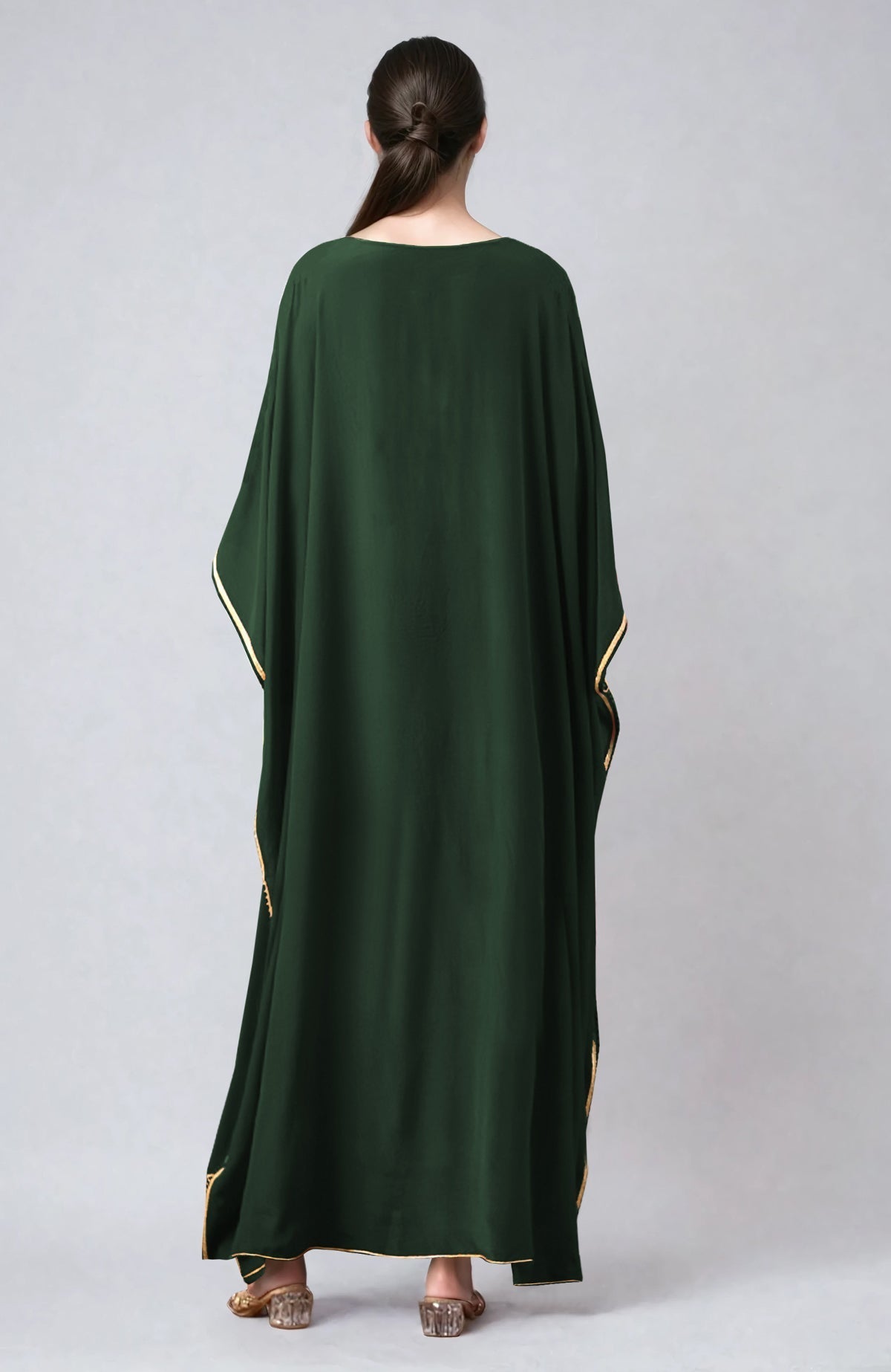 Bottle green kaftan with gold marori and resham embroidery and V-neck design.