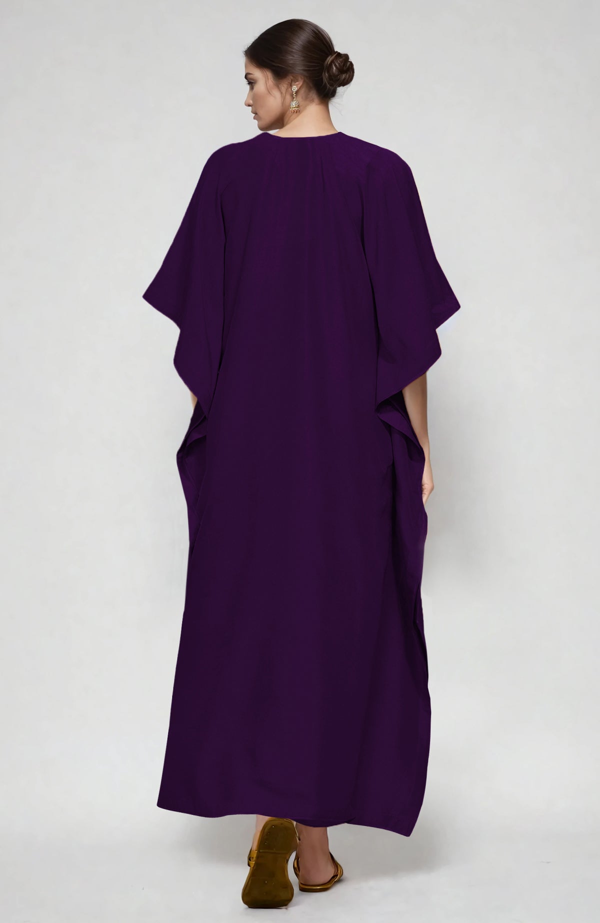 Plum kaftan with white and beige paisley Aari embroidery along the neckline.
