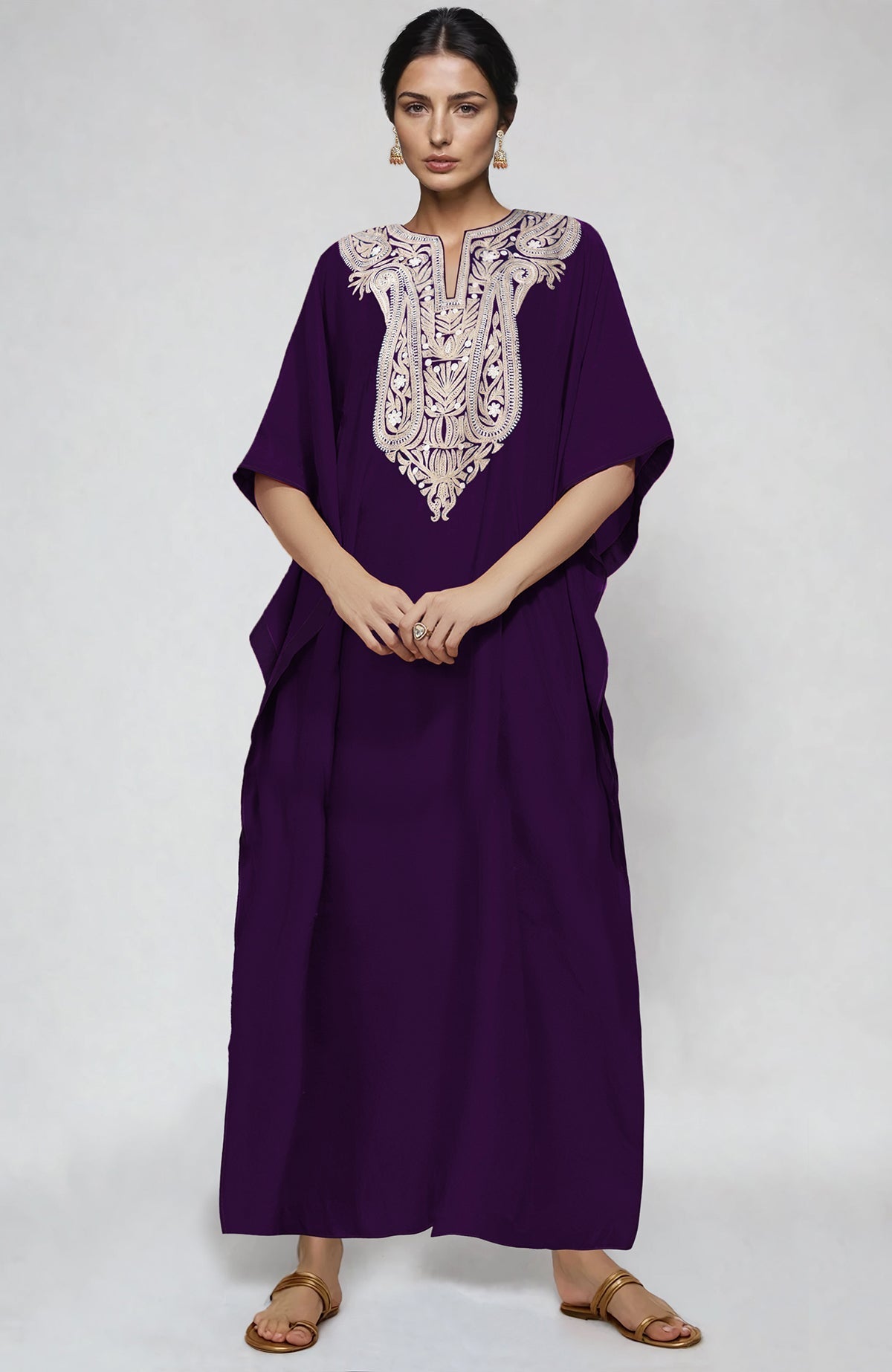 Plum kaftan with white and beige paisley Aari embroidery along the neckline.