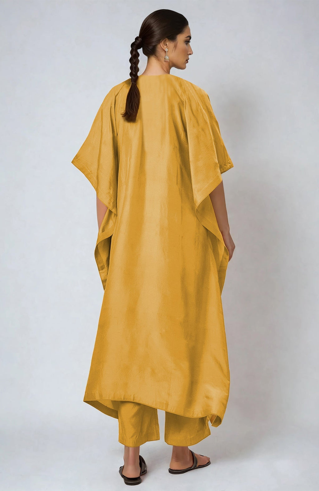 Yellow kaftan with multi-colored Parsi Gara embroidery on placket and cuffs, paired with straight pants