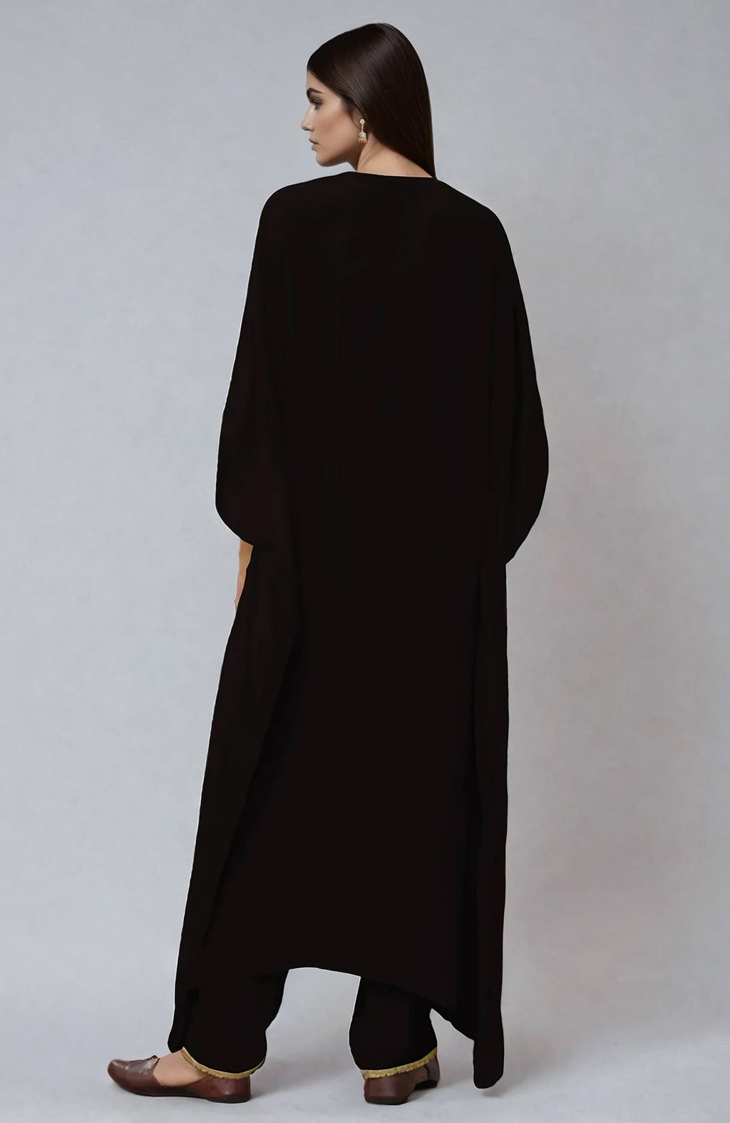 Black kaftan with ivory and beige Parsi Gara embroidery on placket and cuffs, paired with straight pants