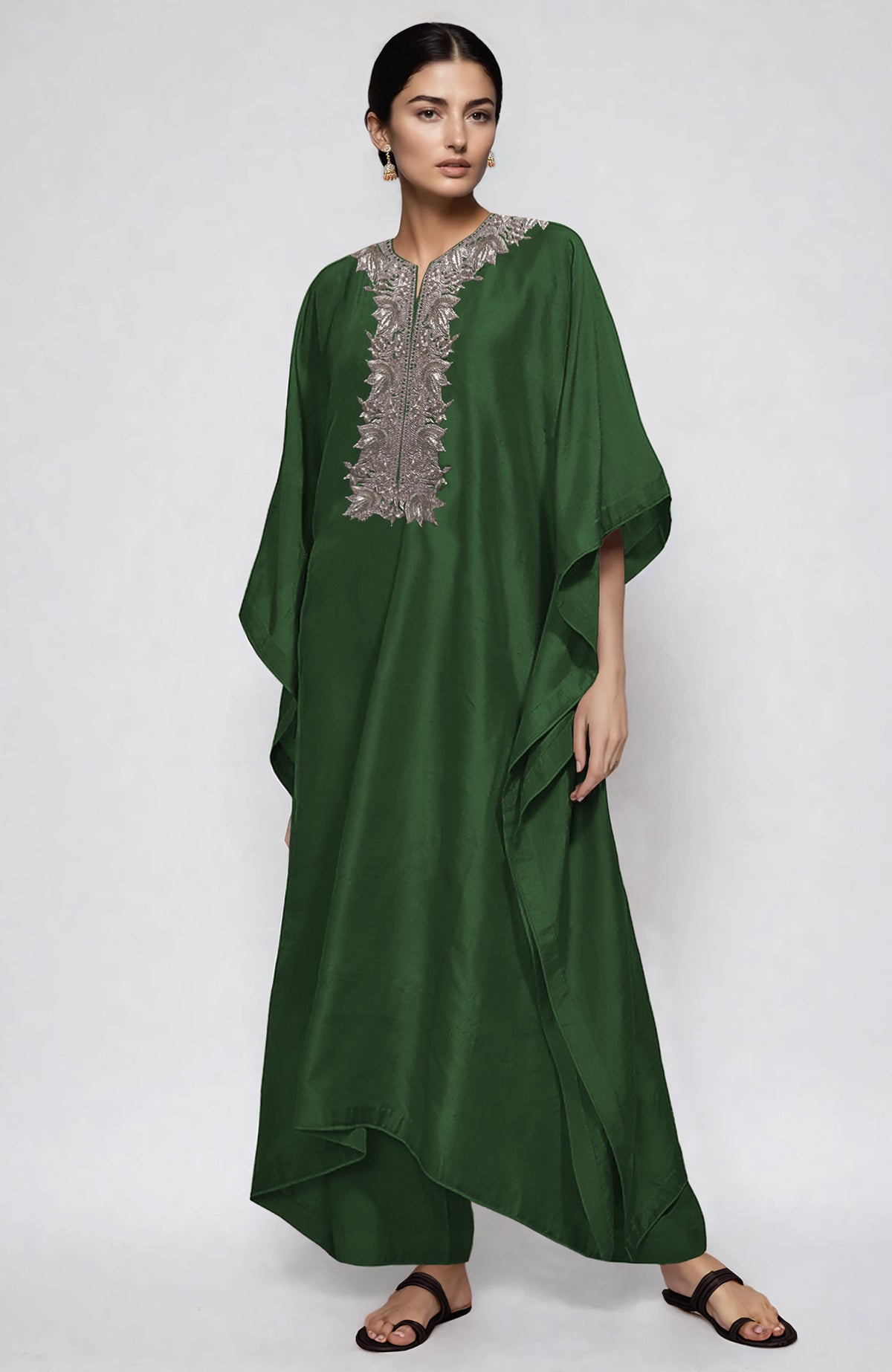 Emerald green kaftan set with intricate silver Kashmiri Tilla embroidery on placket and cuffs.