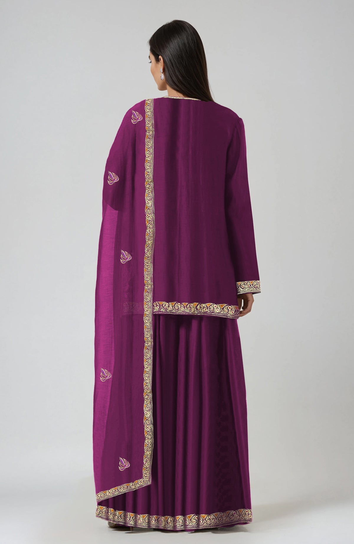 A woman from behind wears a purple sharara set with gold embroidery.
