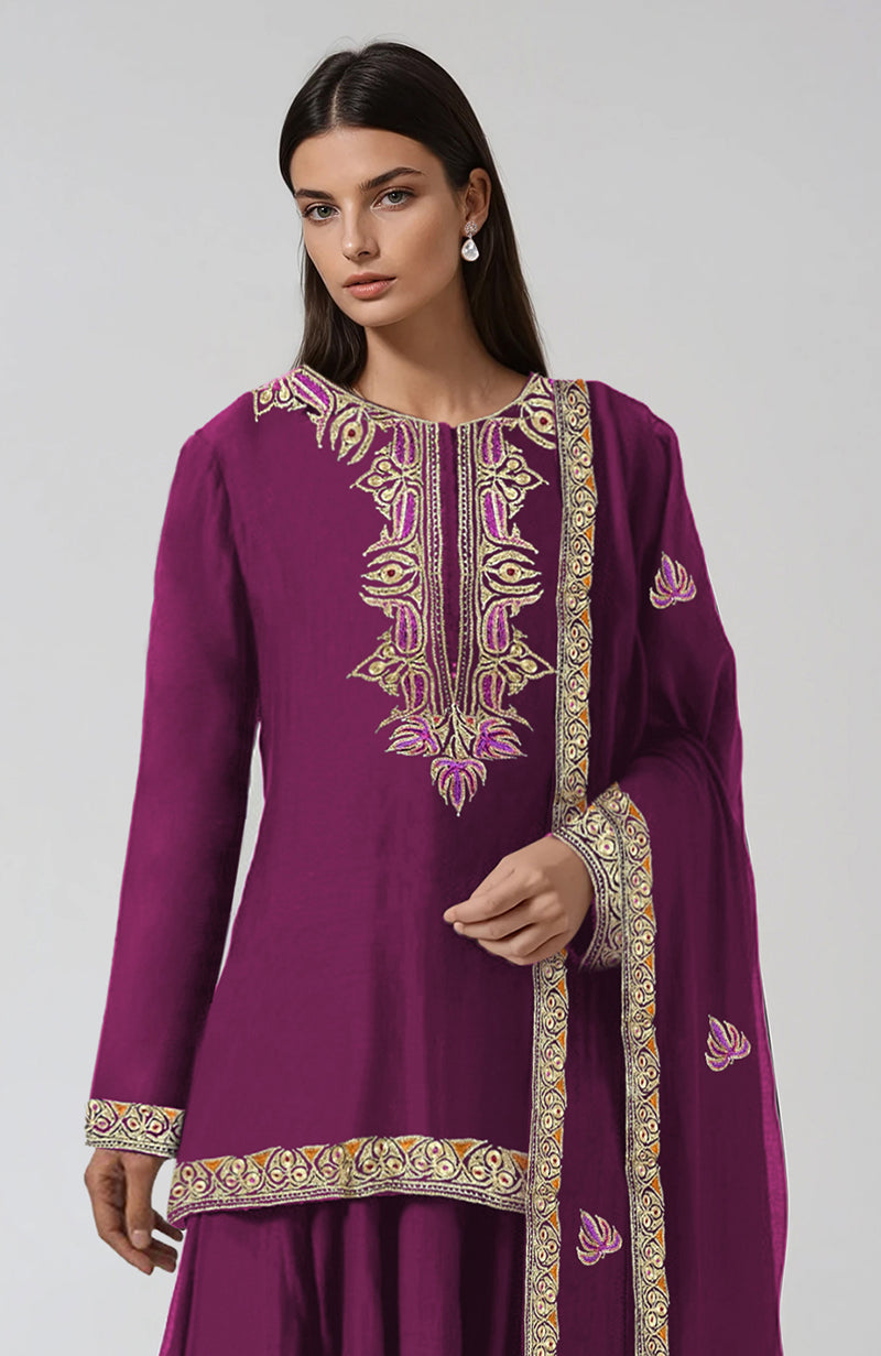 A woman models a peacock pink Kashmiri tilla and resham embroidered sharara set.