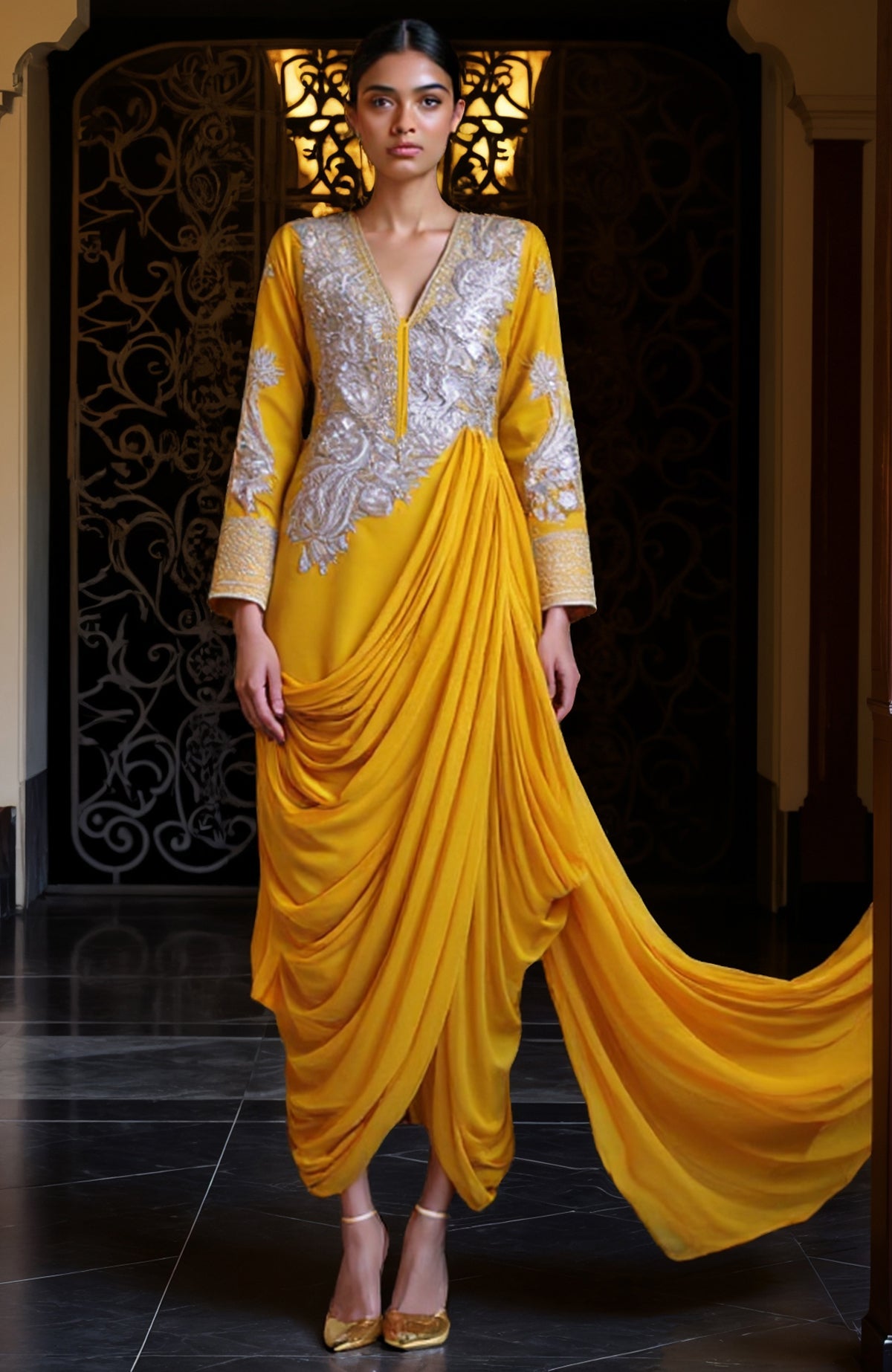 Mustard yellow draped skirt set with silver embroidery and a flowing train.