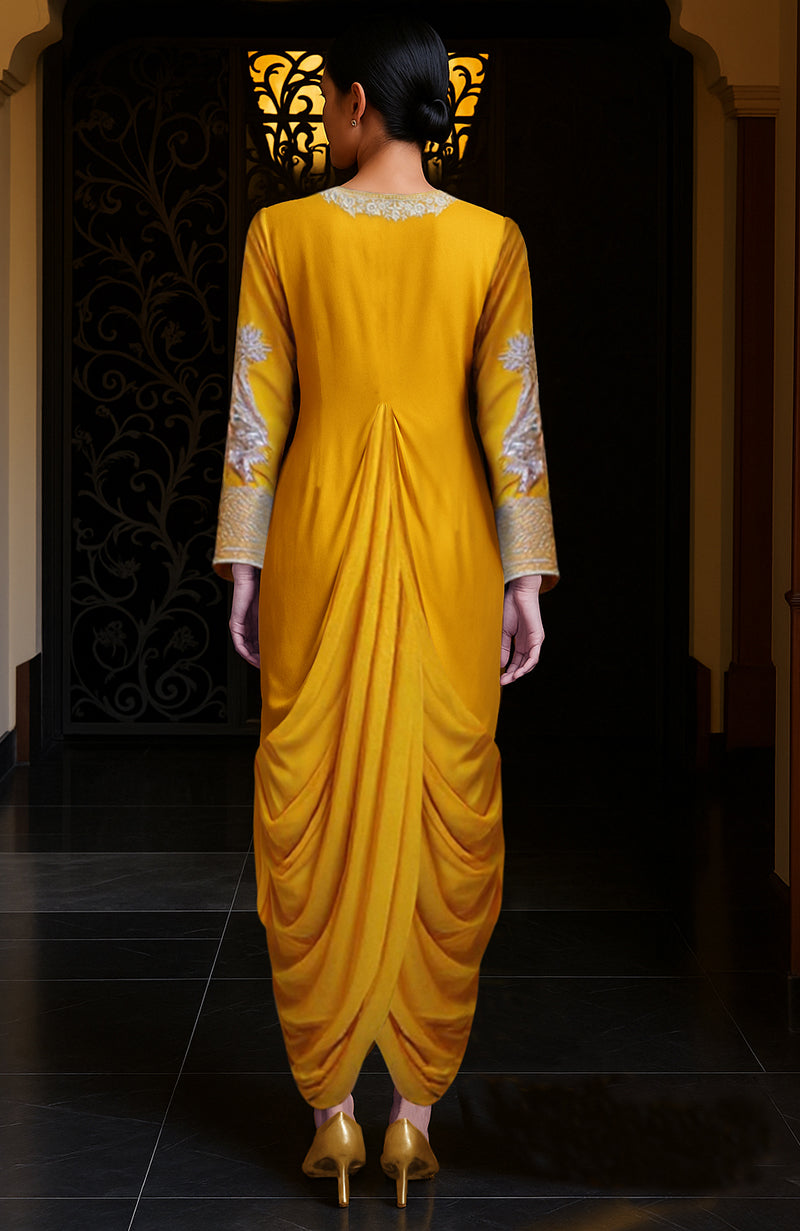 Mustard yellow draped skirt set with silver embroidery on the bodice and sleeves.