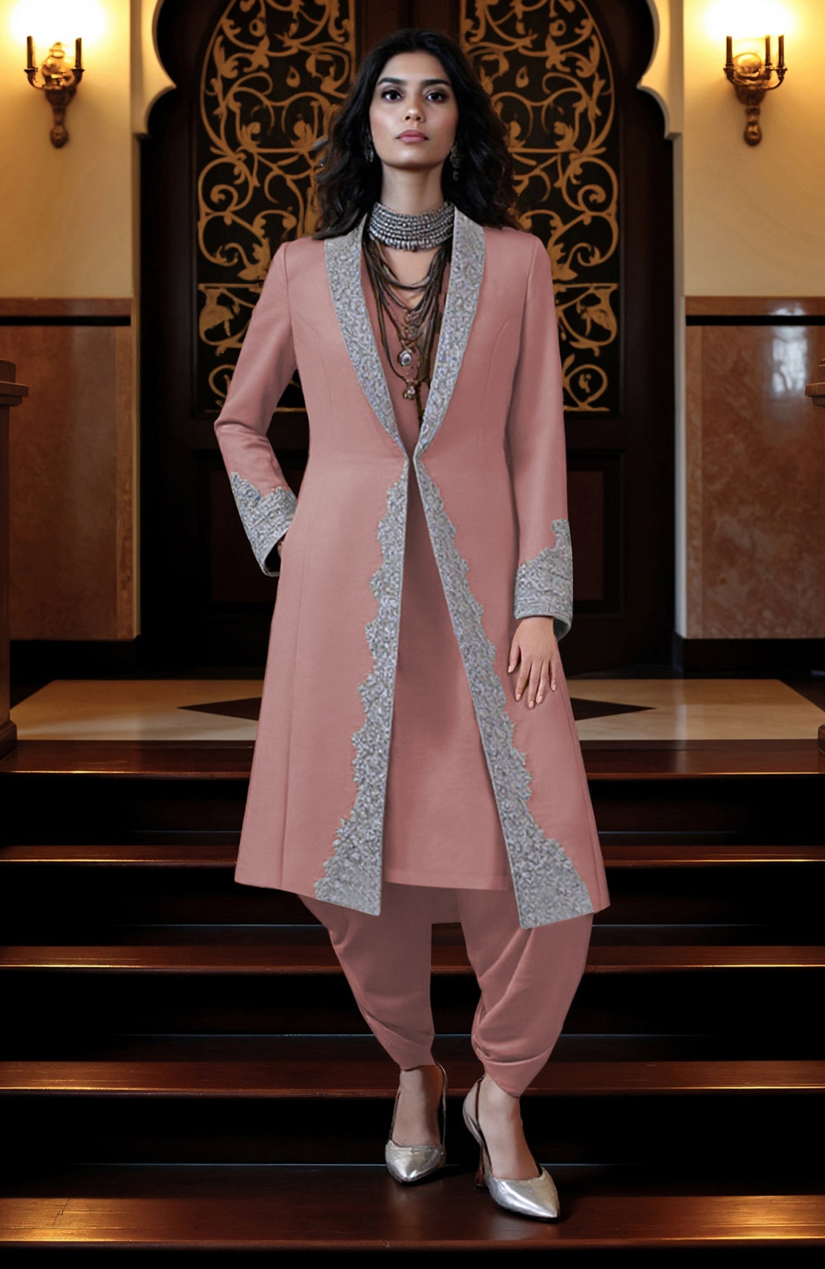 Pink longline jacket with silver embroidery paired with matching tunic and draped dhoti pants.