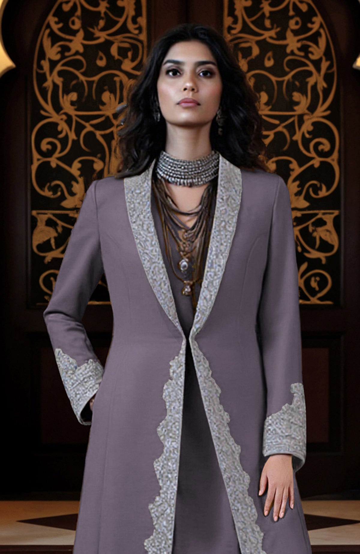 Silver embroidered longline jacket paired with matching tunic and draped dhoti pants set.