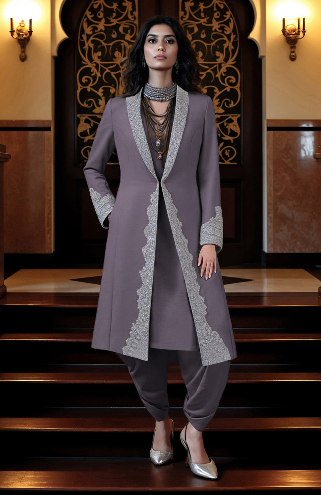 Silver embroidered longline jacket paired with matching tunic and draped dhoti pants set.