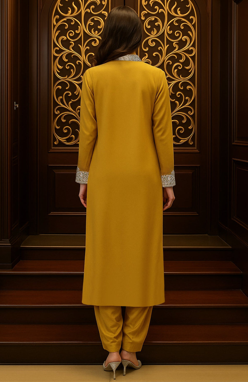 Mustard yellow kurta set with silver floral embroidery, pleated salwar, and embroidered dupatta border.