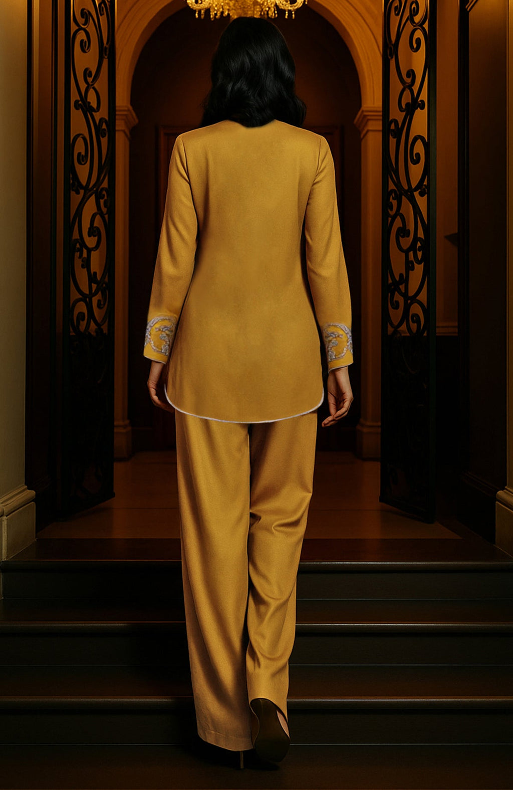 Mustard gold tunic set with silver paisley embroidery, deep V-neck, long sleeves, and wide-leg trousers.
