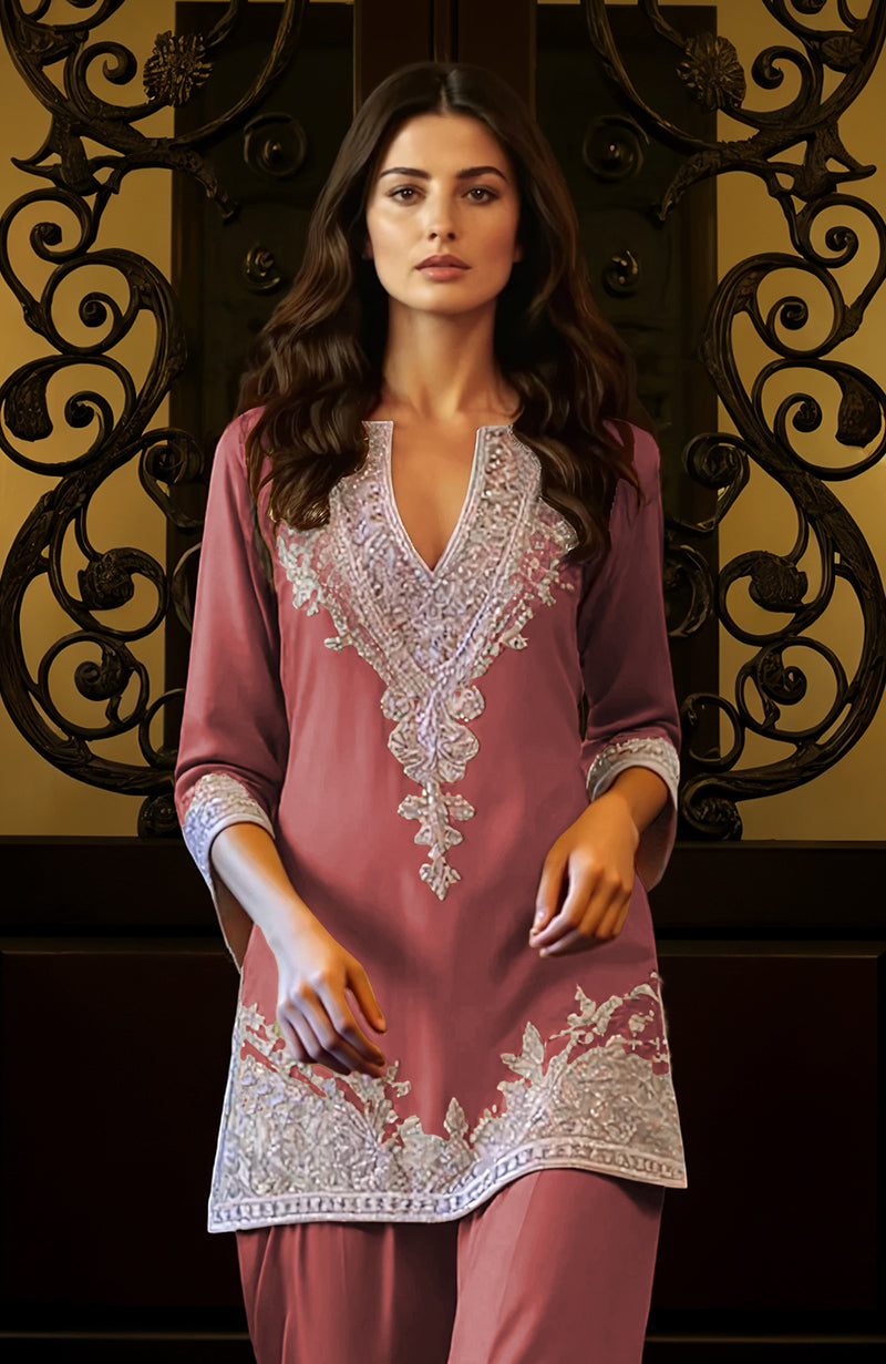 Desert rose tunic with deep V neckline and silver embroidered floral and paisley patterns paired with loose trousers.