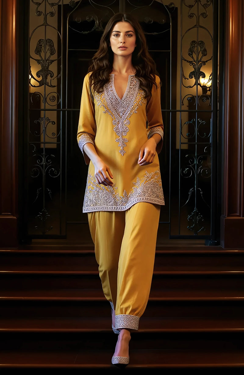 Mauve knee-length tunic with silver embroidery and matching loose trousers with embroidered cuffs