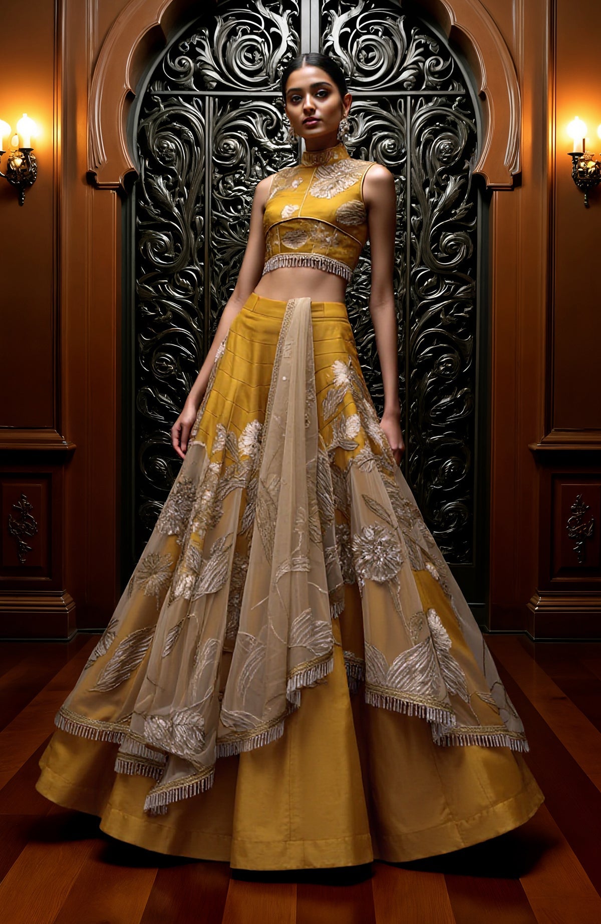 Mustard gold lehenga set with sleeveless embroidered blouse, flared skirt, and sheer dupatta.