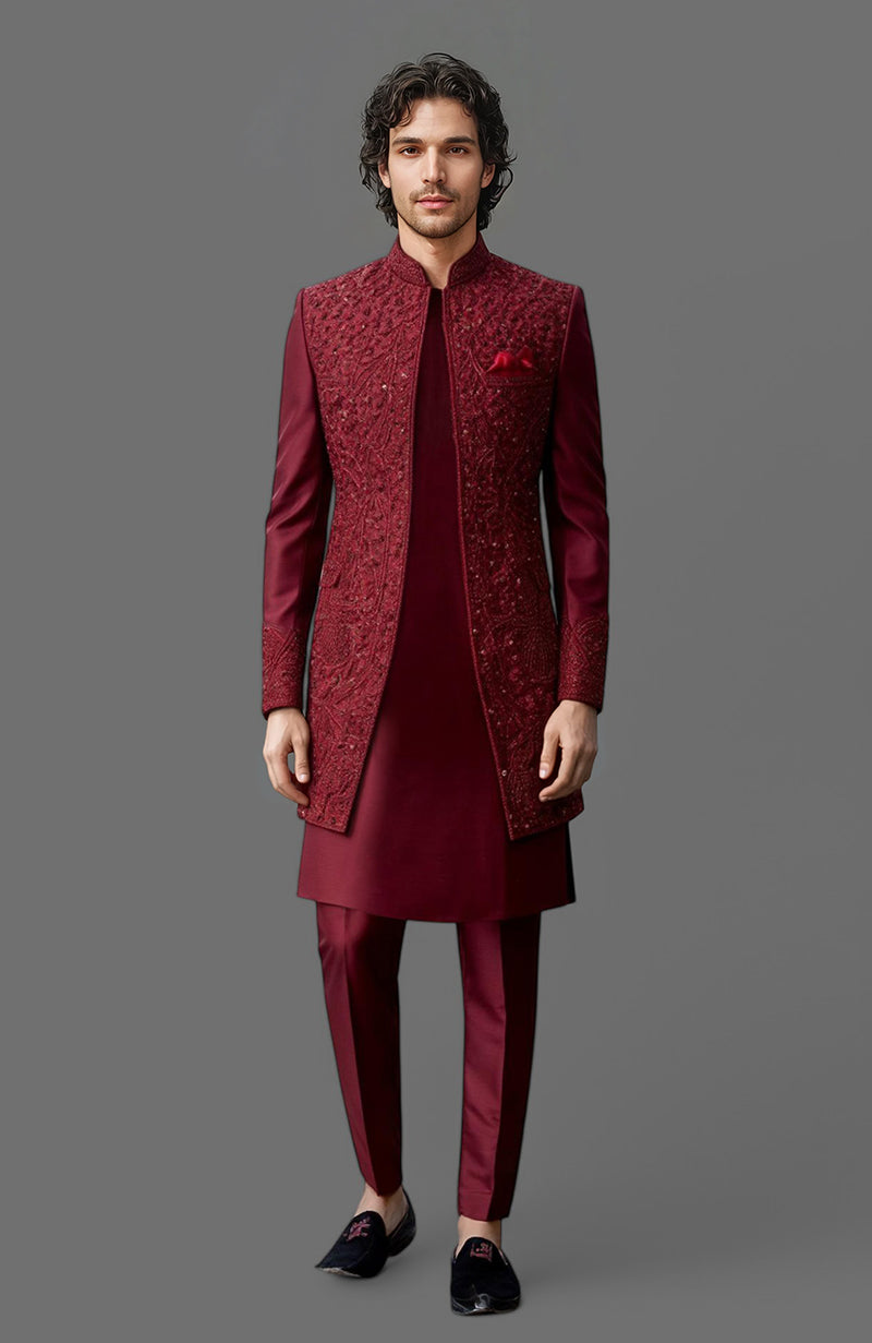 Maroon sherwani jacket with floral embroidery, paired with matching kurta and slim trousers