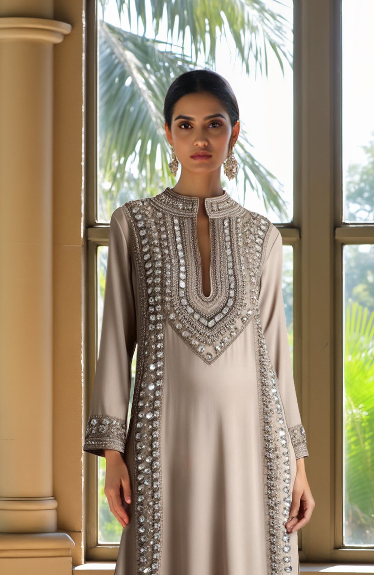 Champagne kurta set with bead and crystal embroidery, long sleeves, and cropped embellished trousers.