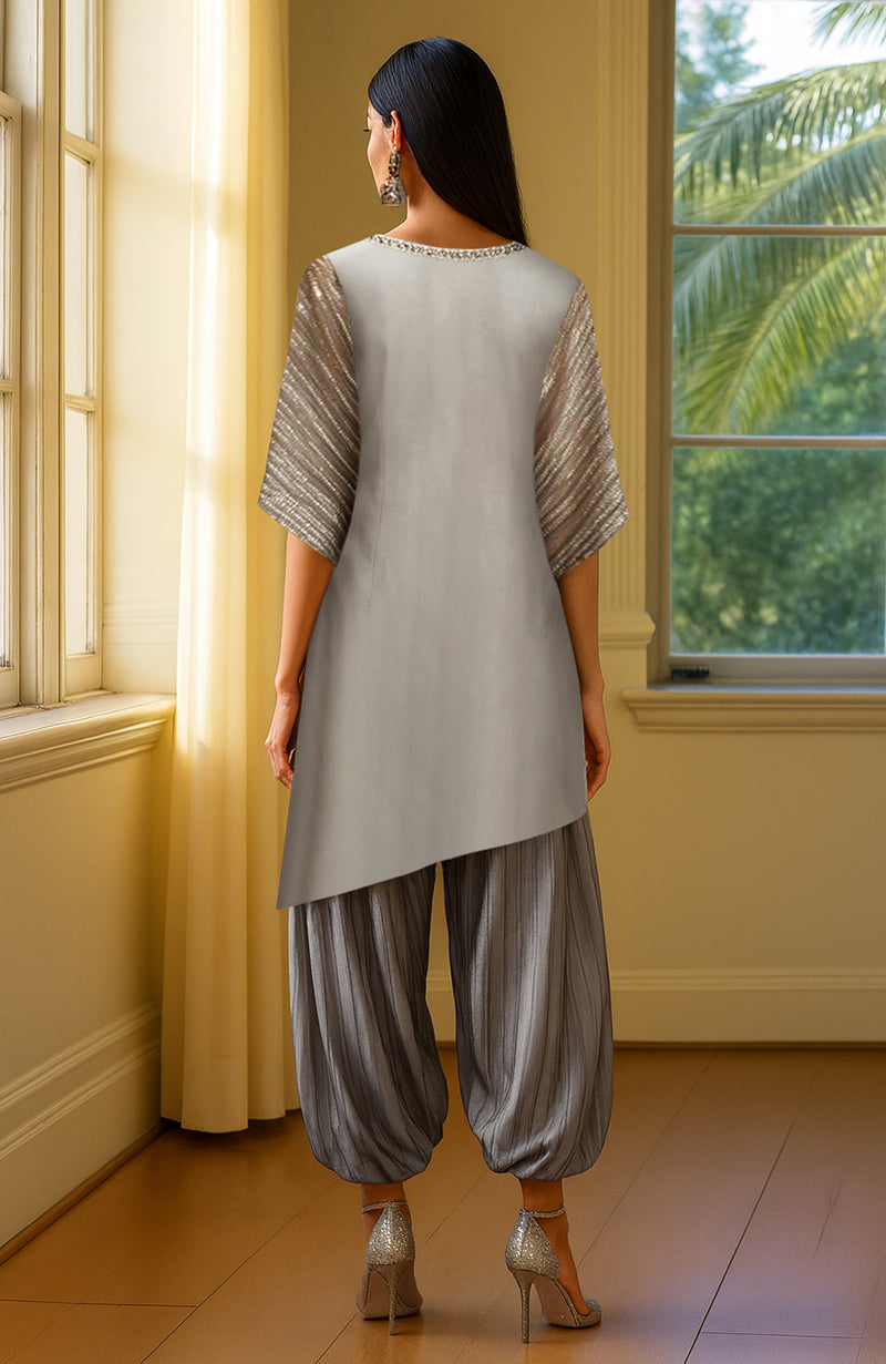 Grey asymmetrical tunic with beads and sequins paired with pleated silver-gray harem pants