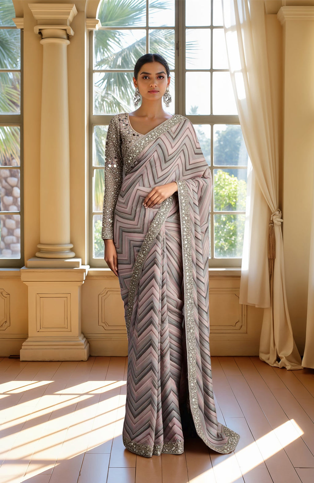 Pastel saree with chevron pattern in taupe, silver, lavender, and embellished blouse with mirror work