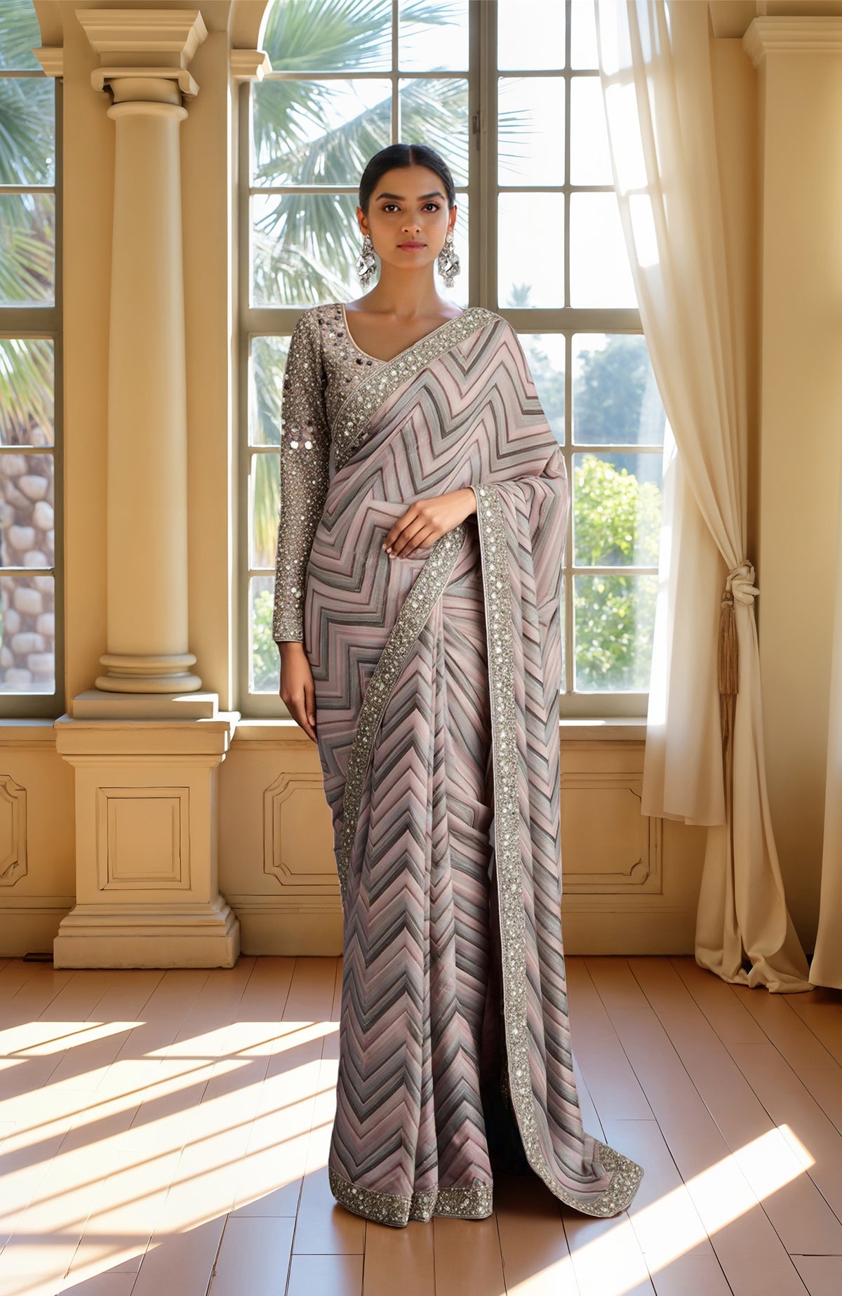 Pastel saree with chevron pattern in taupe, silver, lavender, and embellished blouse with mirror work