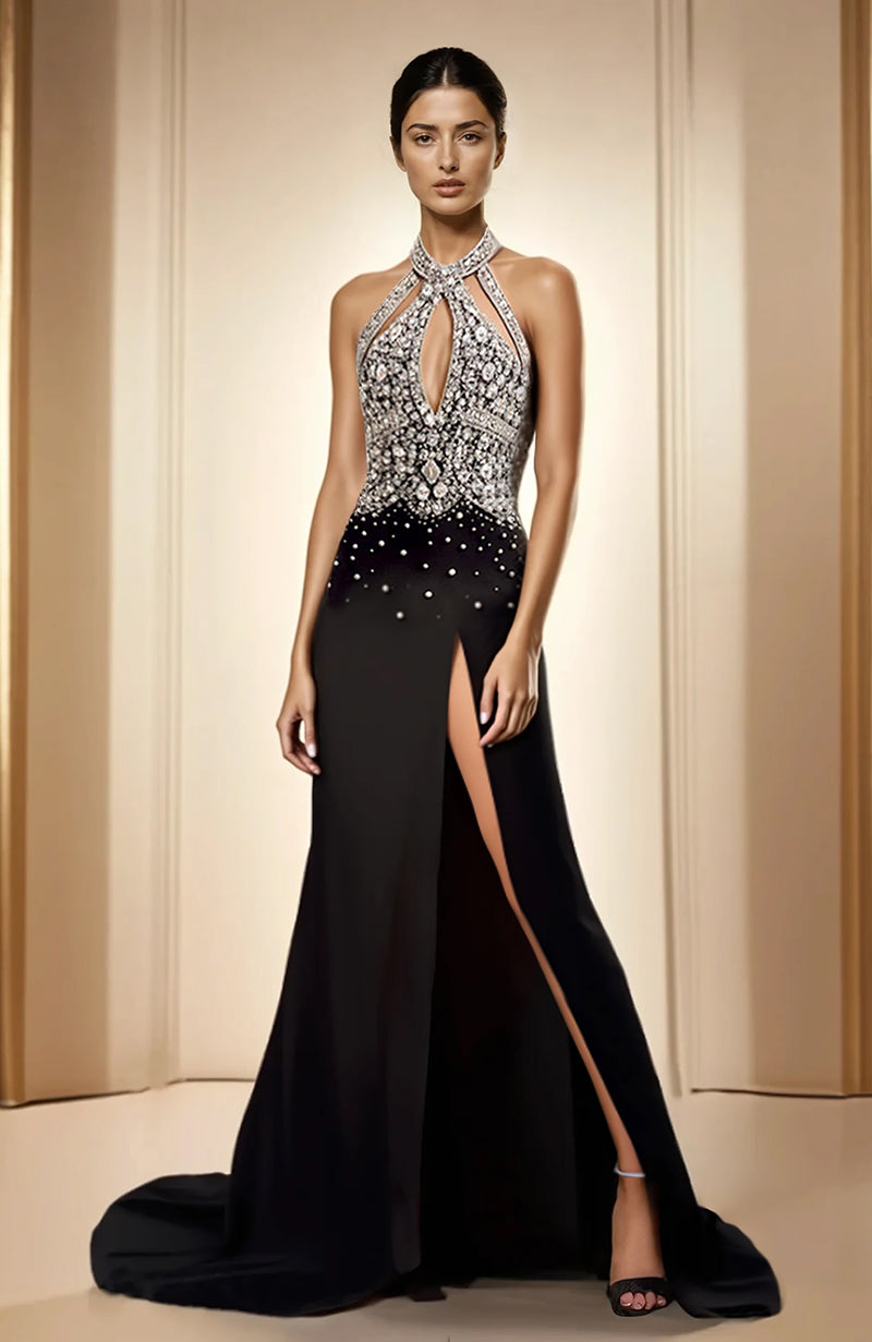 Black halter gown with crystal embellished bodice, keyhole cutout, and thigh-high slit.