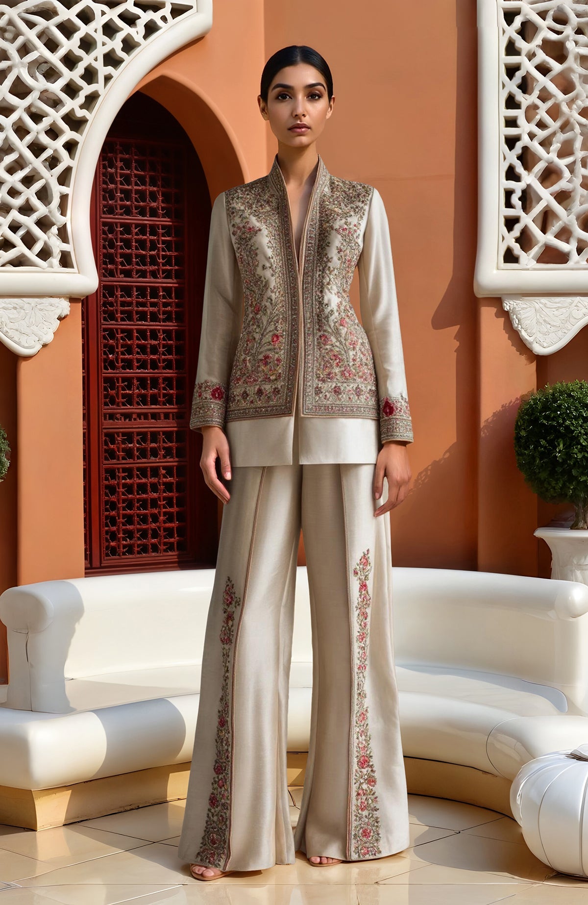 Champagne jacket with floral embroidery and matching wide-leg trousers with side floral details.