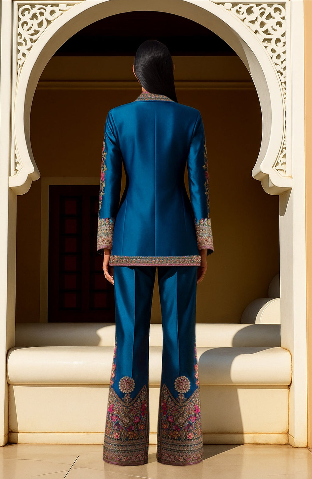 Teal two-piece ensemble with gold, pink, and green zardozi and resham embroidery and beadwork.