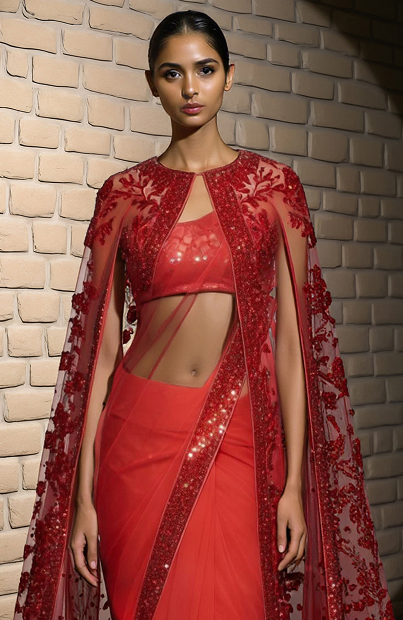 Scarlet red saree with sequined border and sheer embroidered floral cape with beadwork.